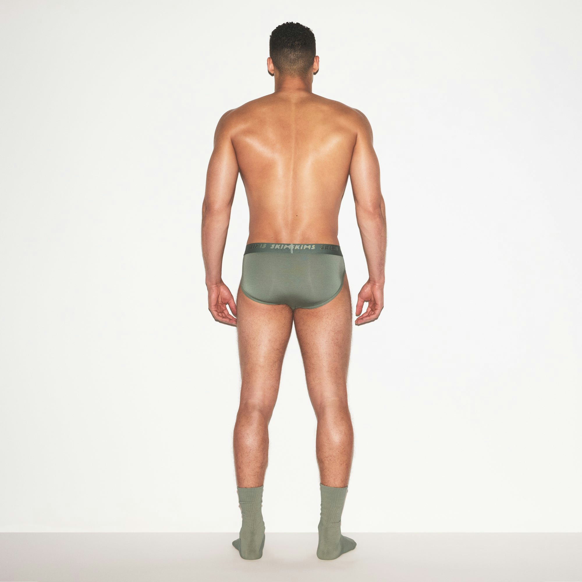 SKIMS STRETCH MENS BRIEF | LAUREL ON A MODEL FRONT VIEW | FOCUS: 0.0, 1.0, 0.9