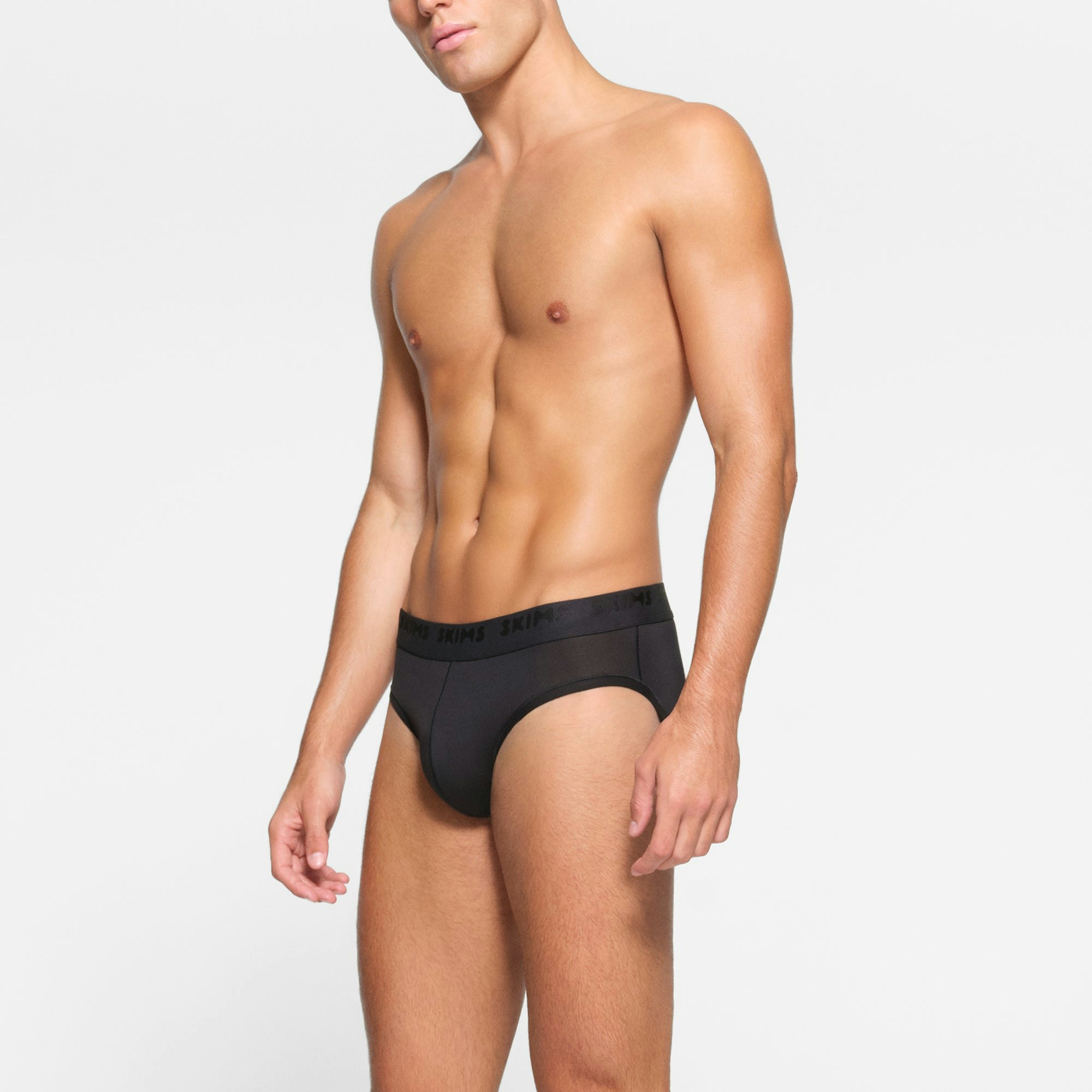 SKIMS STRETCH MENS BRIEF 3-PACK WORN BY A MODEL IN SIDE VIEW