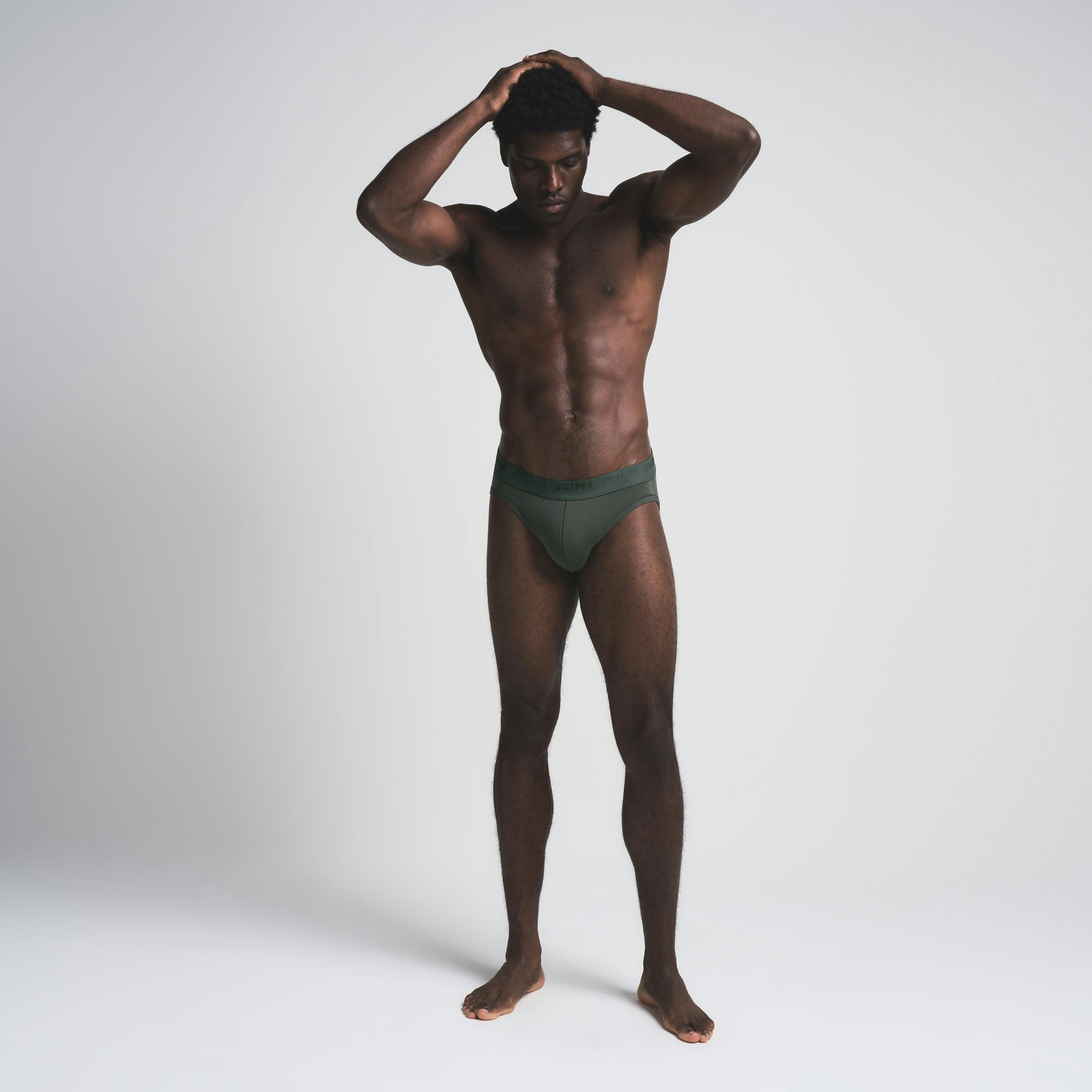 SKIMS STRETCH MENS BRIEF | DEEP SEA ON A MODEL FRONT VIEW | FOCUS: 0.0, 1.0, 0.9