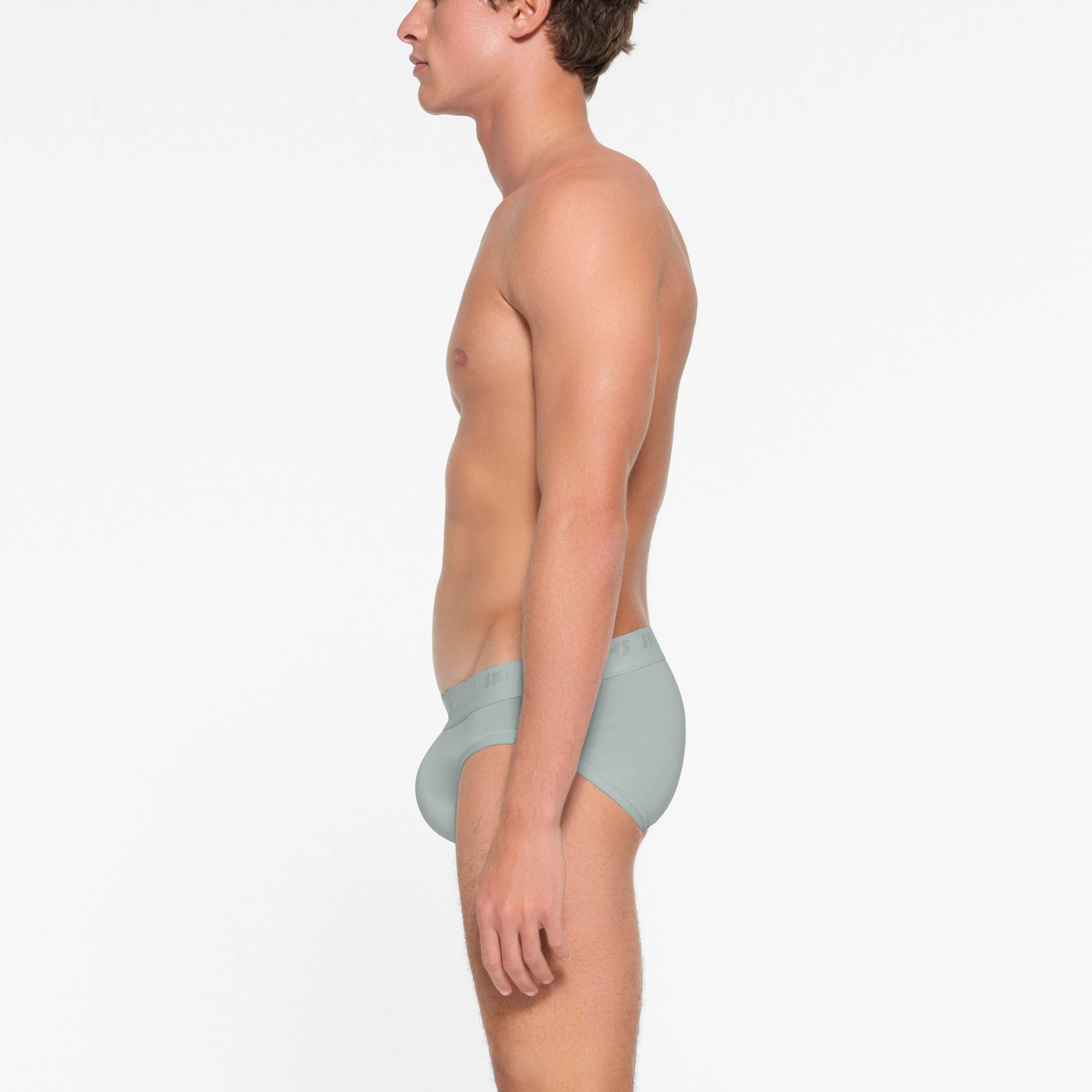 SKIMS STRETCH MENS BRIEF | VAPOR ON A MODEL SIDE VIEW