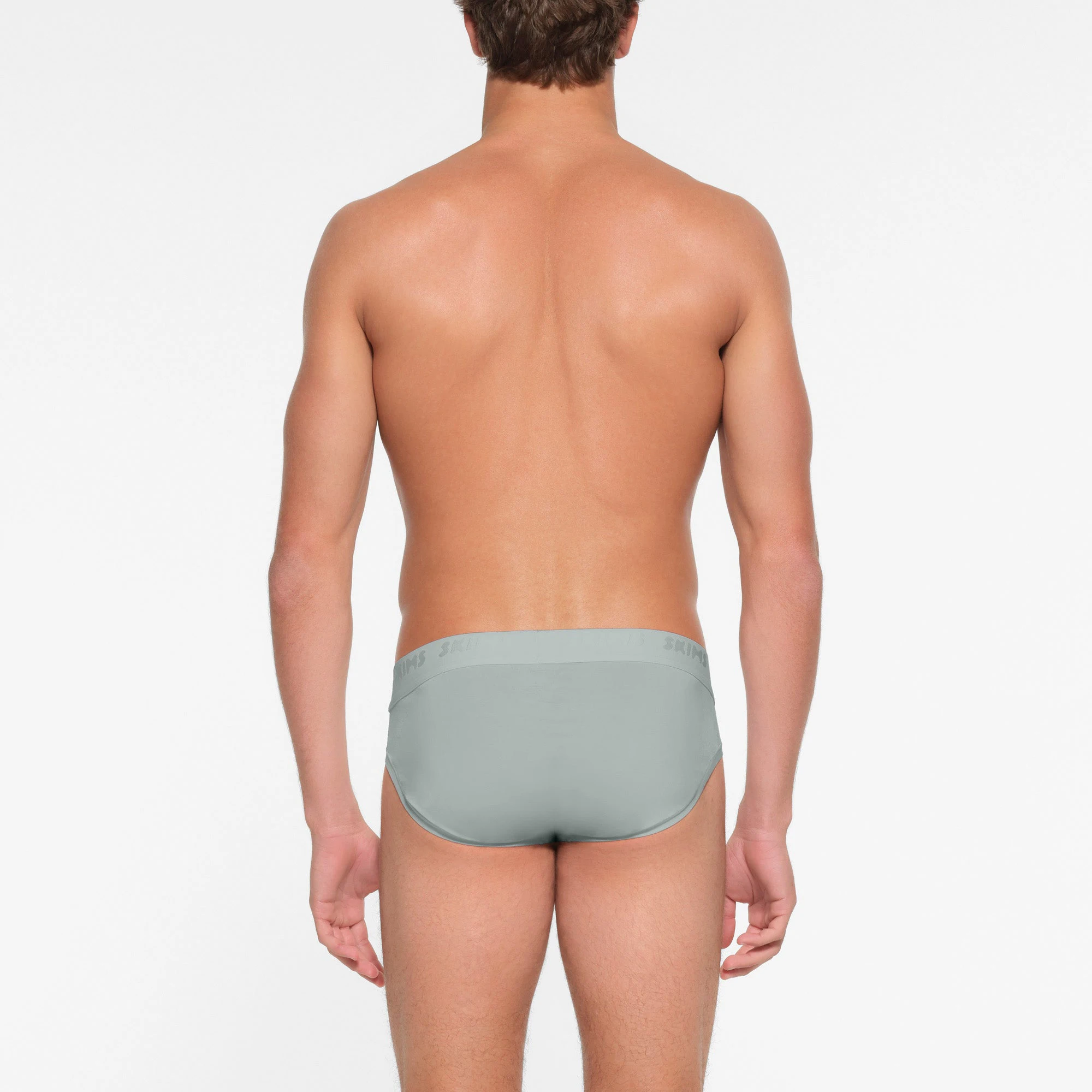 SKIMS STRETCH MENS BRIEF | VAPOR ON A MODEL BACK VIEW