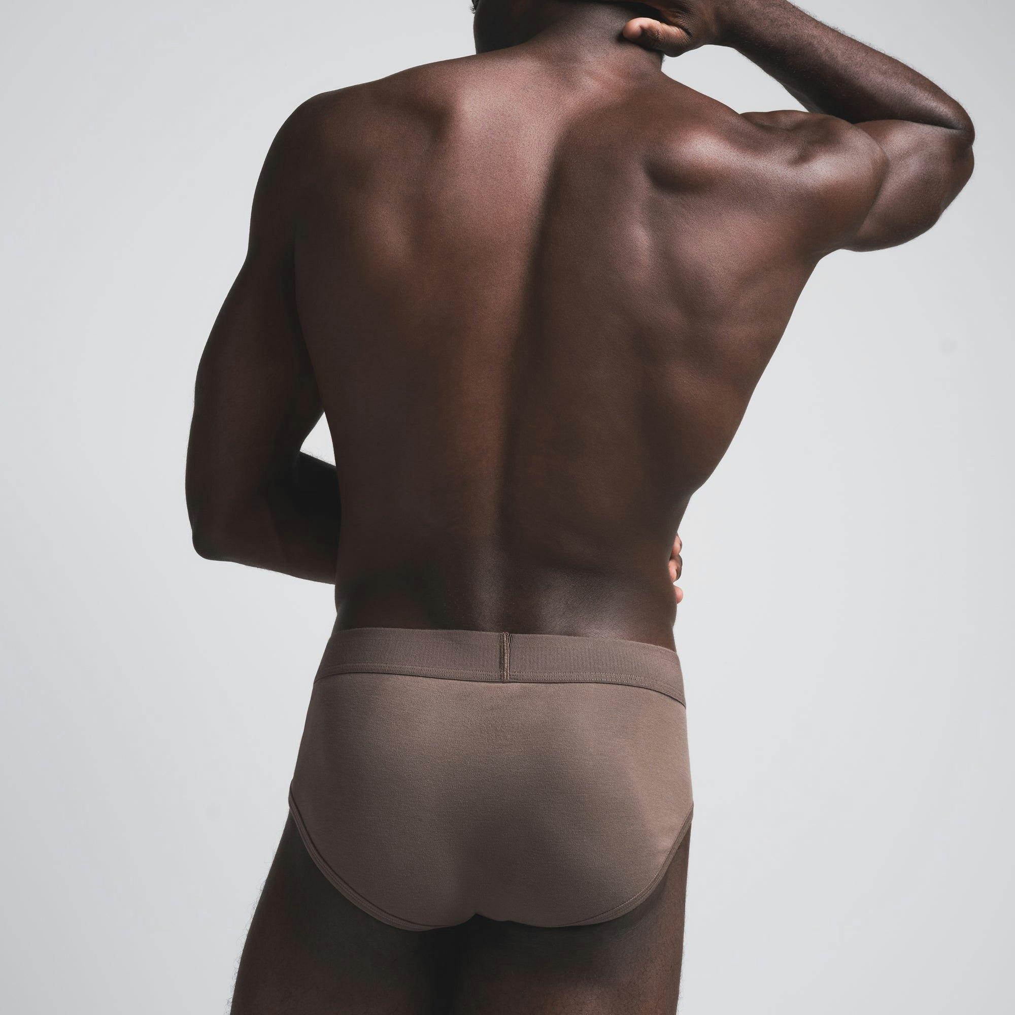 SKIMS COTTON MENS BRIEF | AMETHYST ON A MODEL SIDE VIEW