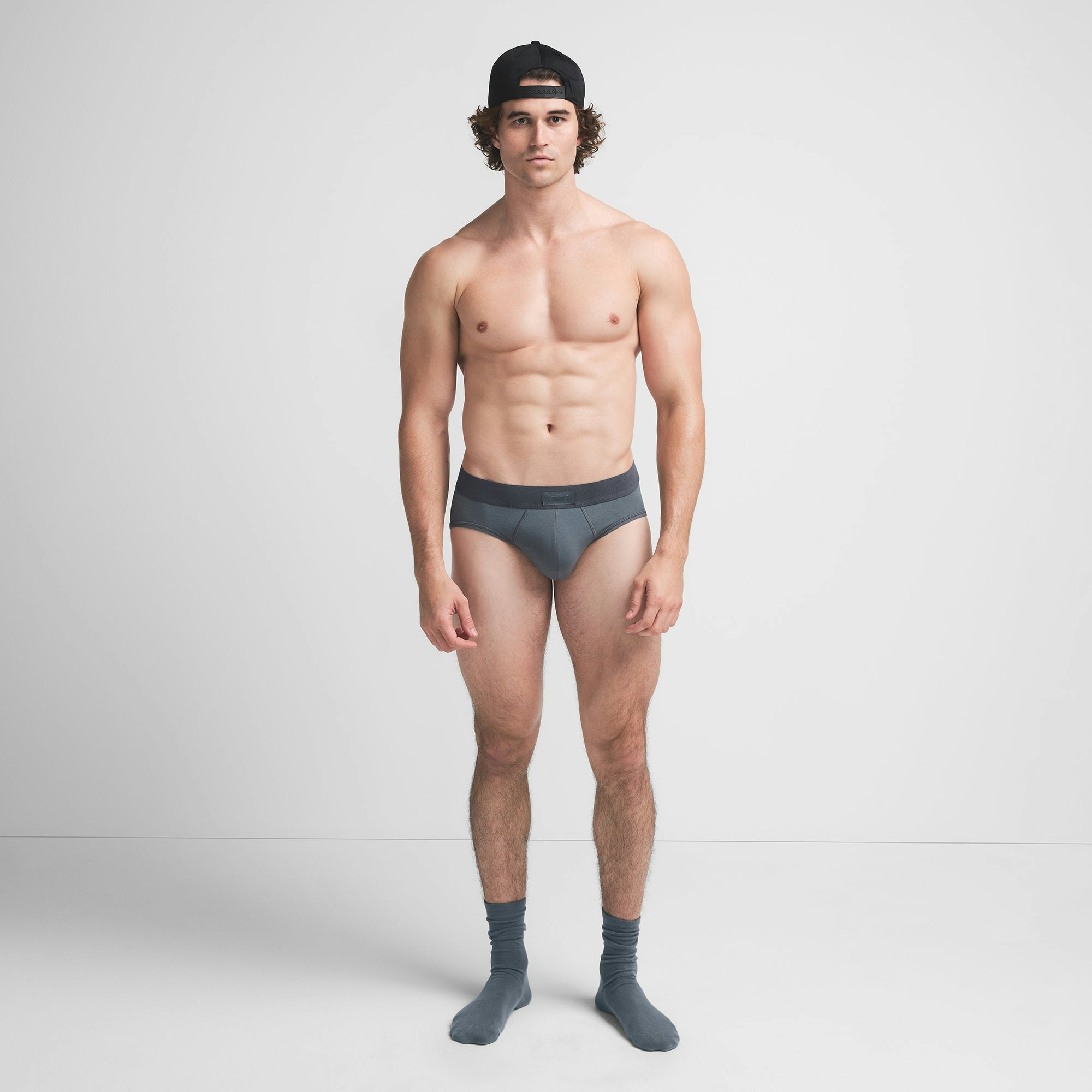 SKIMS COTTON MENS BRIEF | KYANITE ON A MODEL FRONT VIEW @ | FOCUS: 0.9, 0.1, 0.7