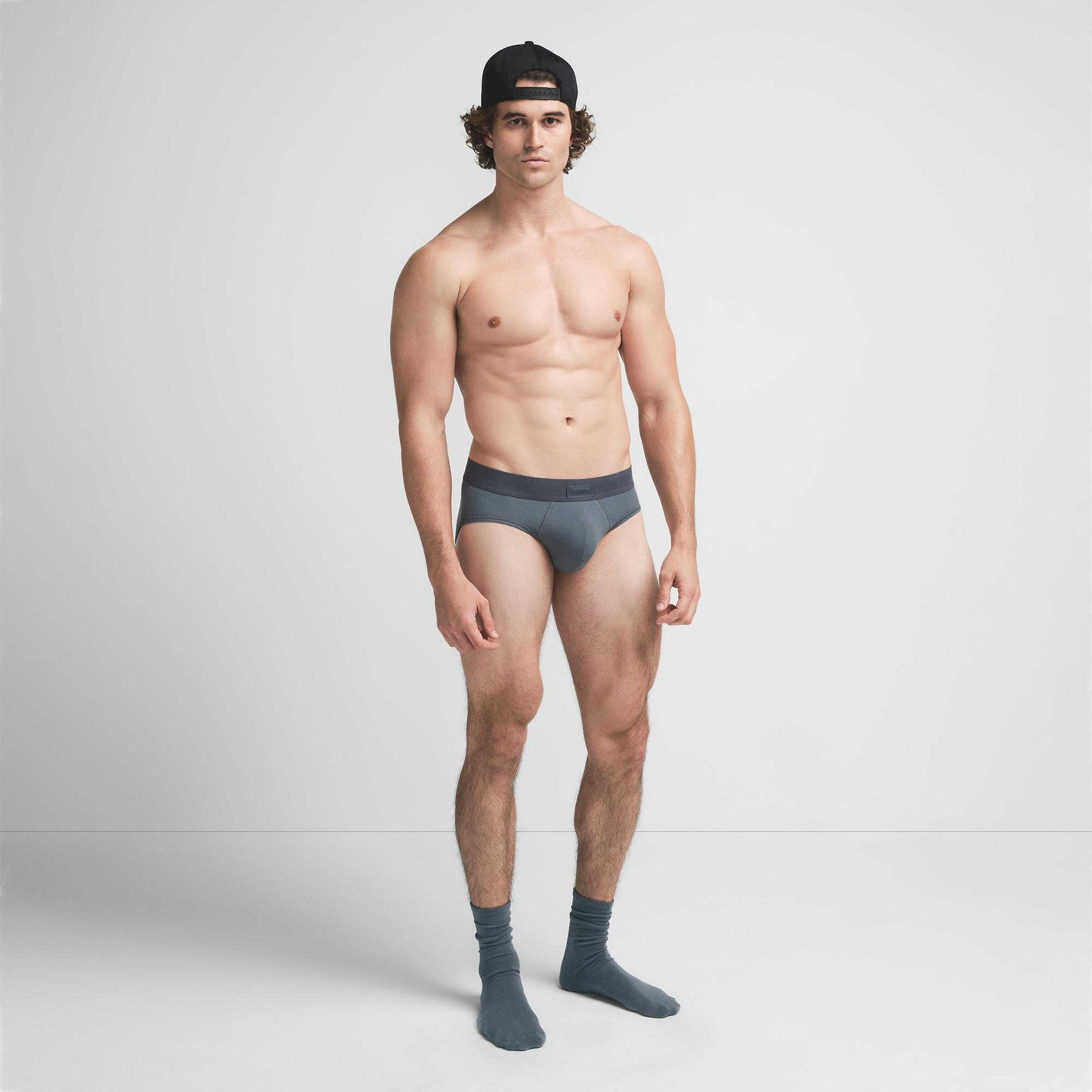 SKIMS COTTON MENS BRIEF | KYANITE ON A MODEL FRONT VIEW @ | FOCUS: 0.9, 0.1, 0.7