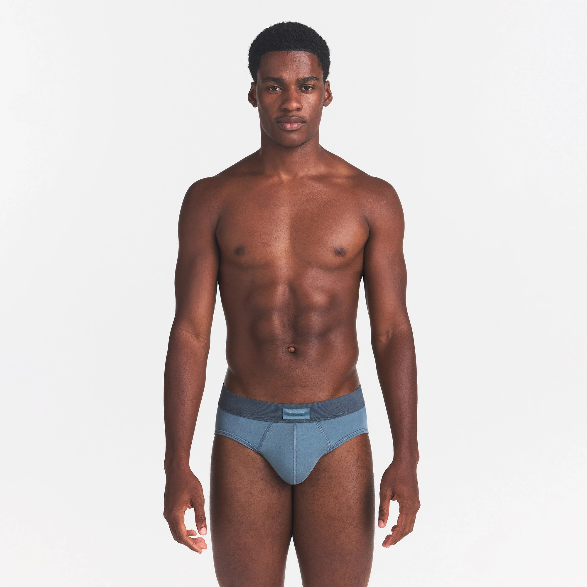 SKIMS COTTON MENS BRIEF | KYANITE ON A MODEL FRONT VIEW