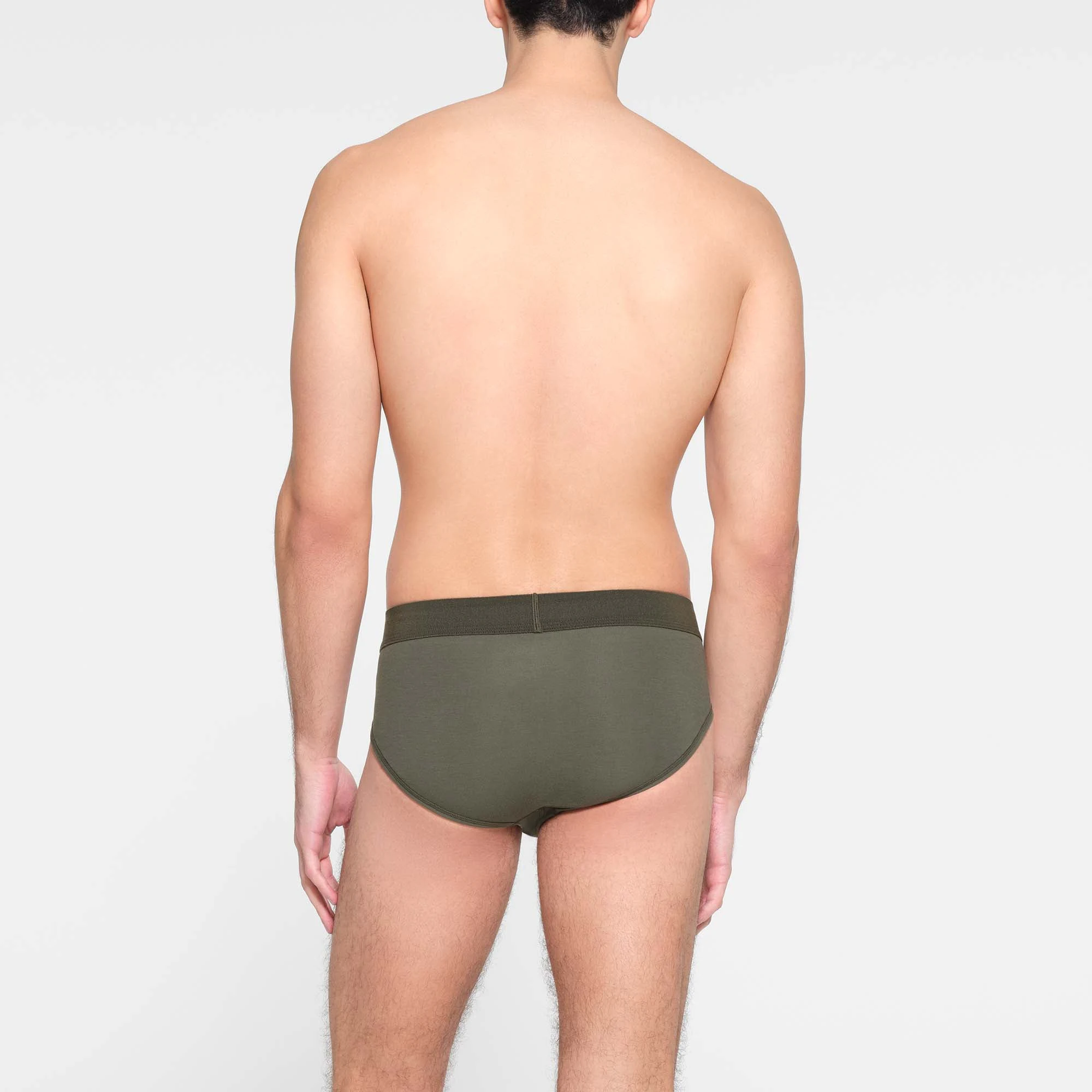 SKIMS COTTON MENS BRIEF  ON A MODEL BACK VIEW