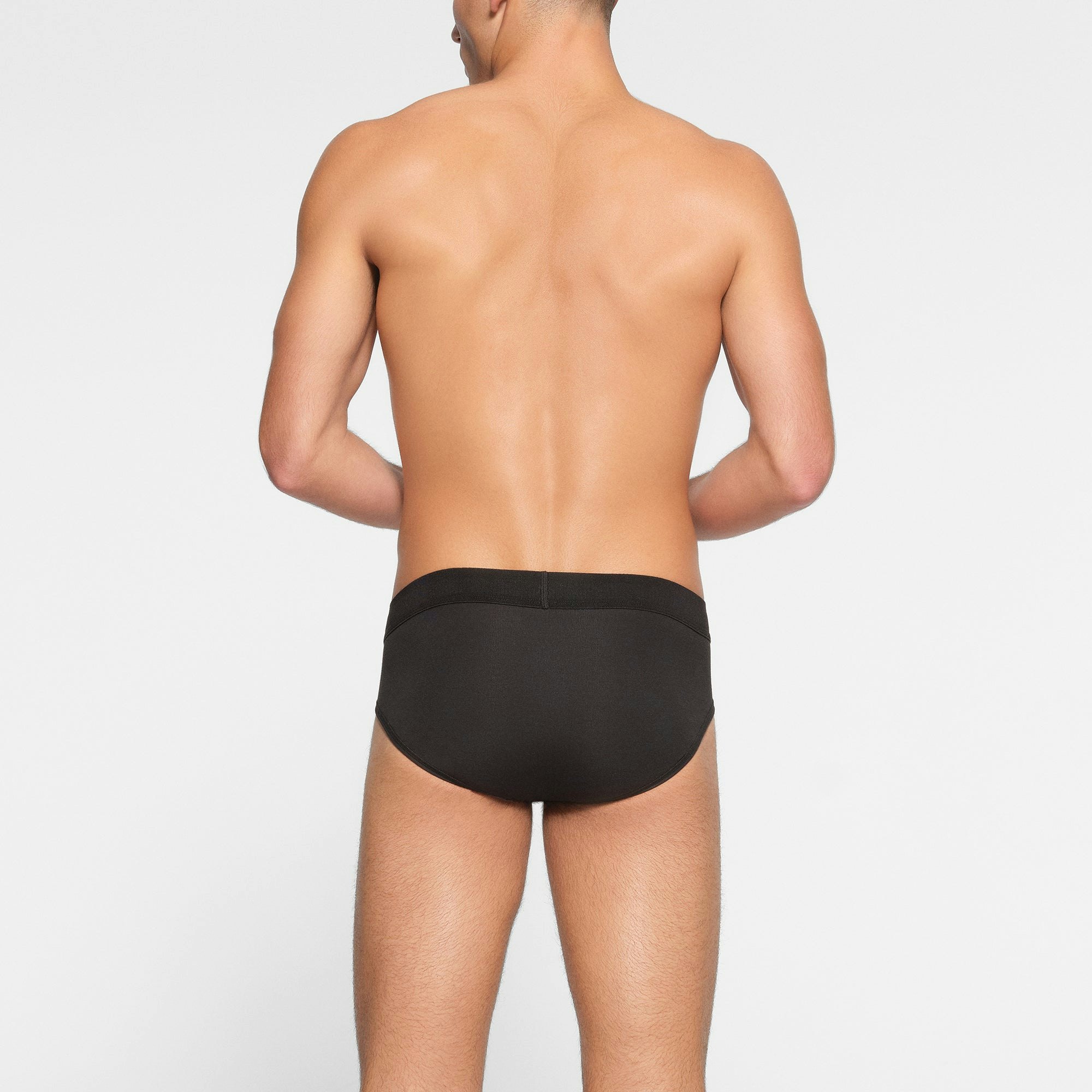 SKIMS COTTON MENS BRIEF 3-PACK ON A MODEL BACK VIEW