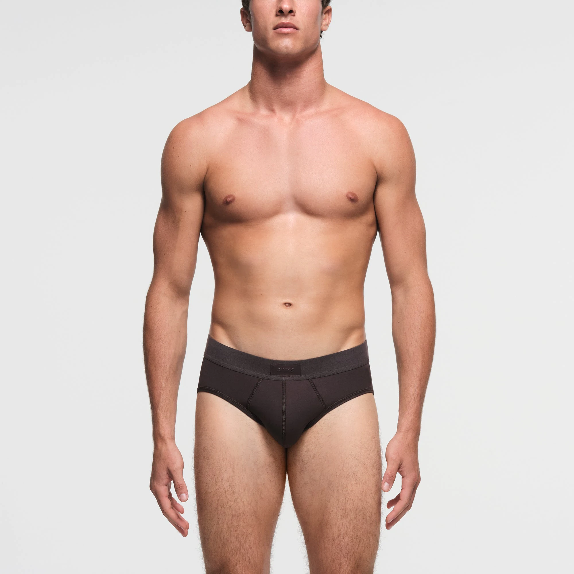 SKIMS COTTON MENS BRIEF | PHOENIX ON A MODEL FRONT VIEW