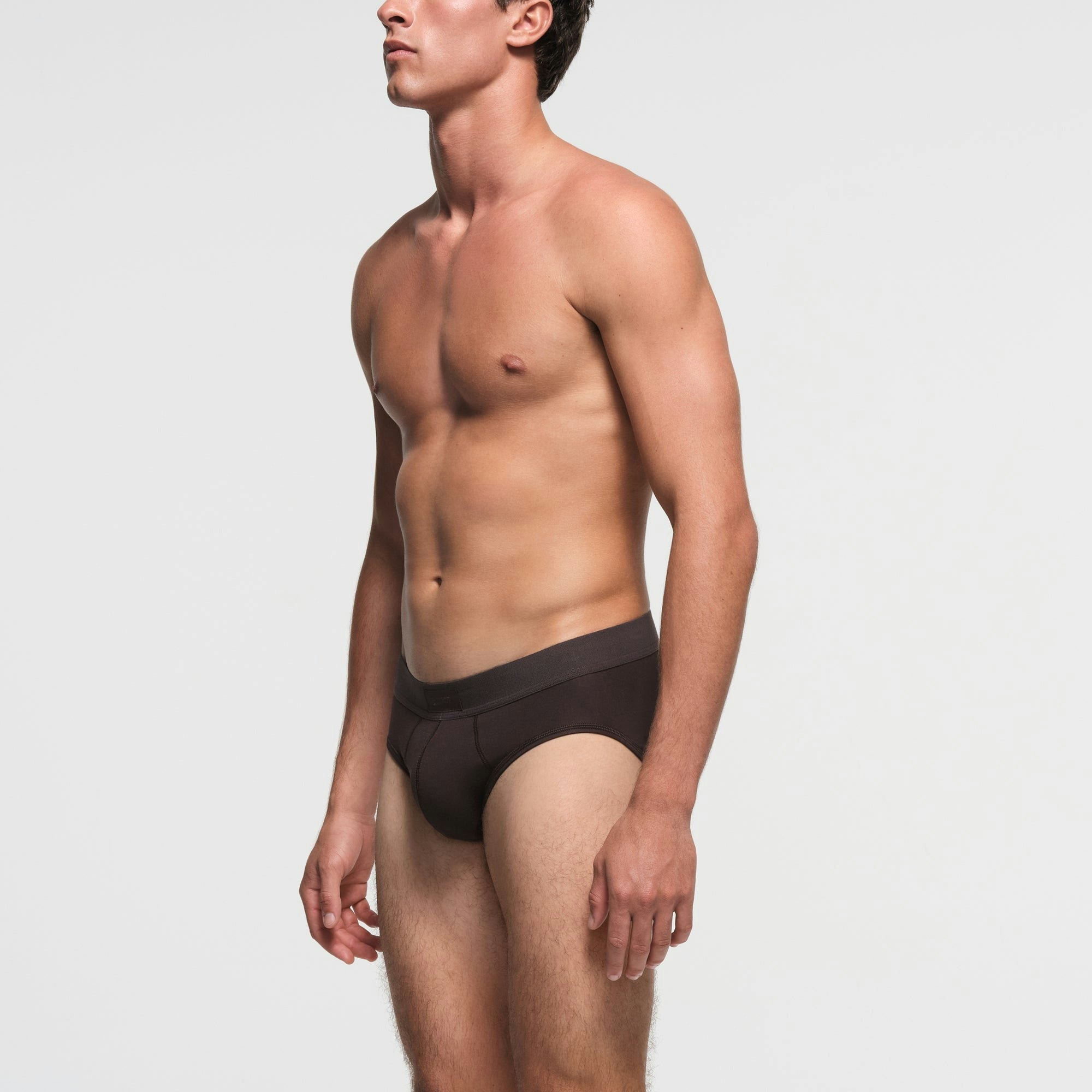 SKIMS COTTON MENS BRIEF | PHOENIX ON A MODEL SIDE VIEW