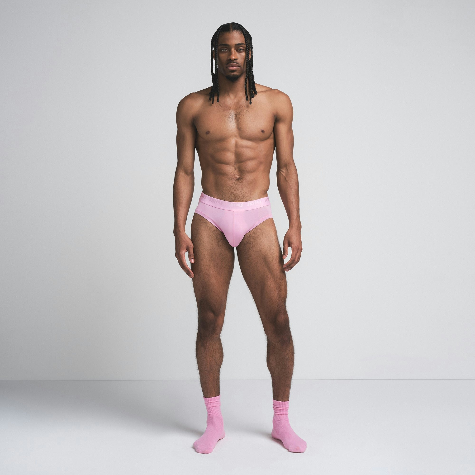 SKIMS STRETCH MENS BRIEF 3-PACK | BUBBLEGUM MIRROR MULTI ON A MODEL FRONT VIEW | FOCUS: 0.0, 1.0, 0.9