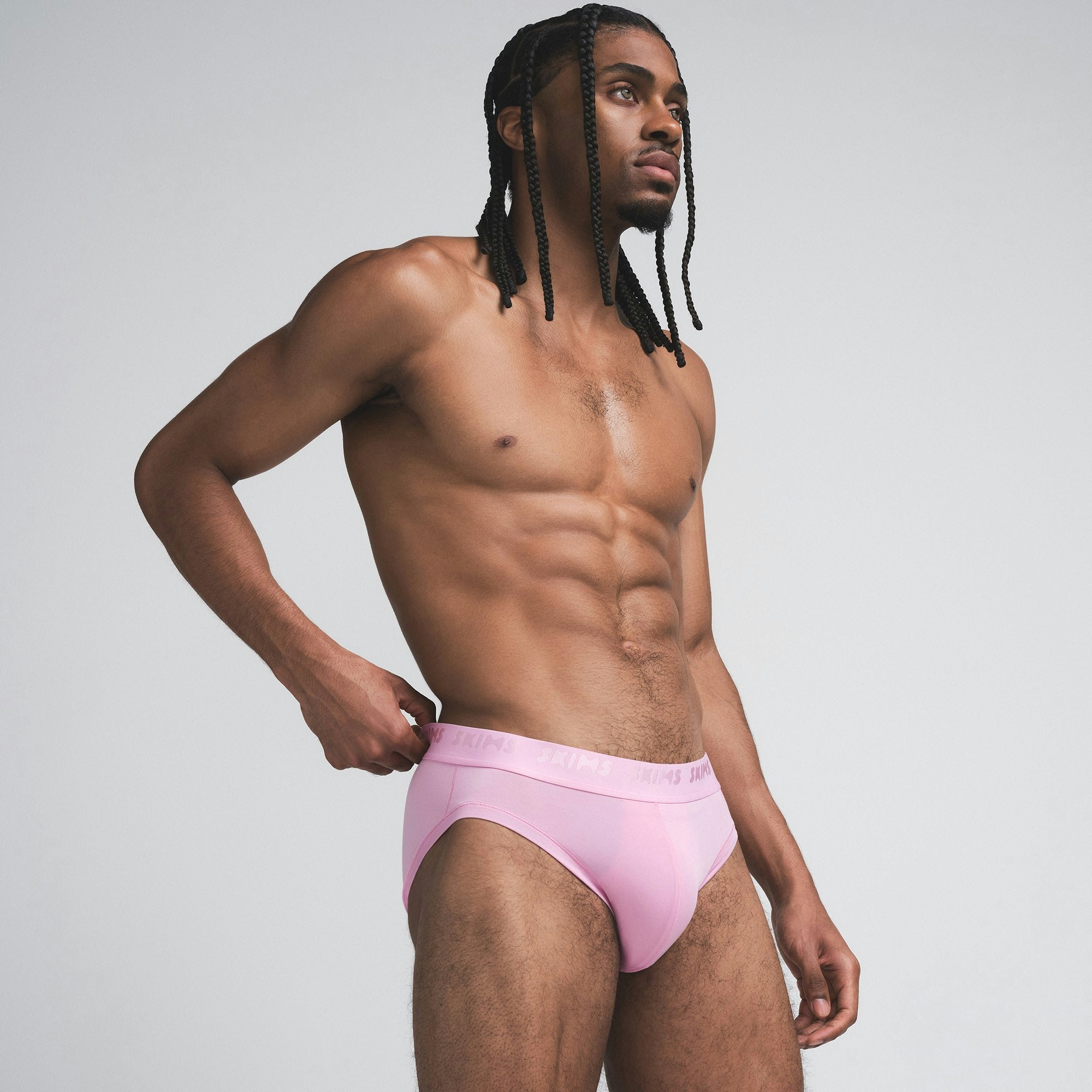 SKIMS STRETCH MENS BRIEF 3-PACK | BUBBLEGUM MIRROR MULTI ON A MODEL SIDE VIEW | FOCUS: 0.0, 1.0, 0.9