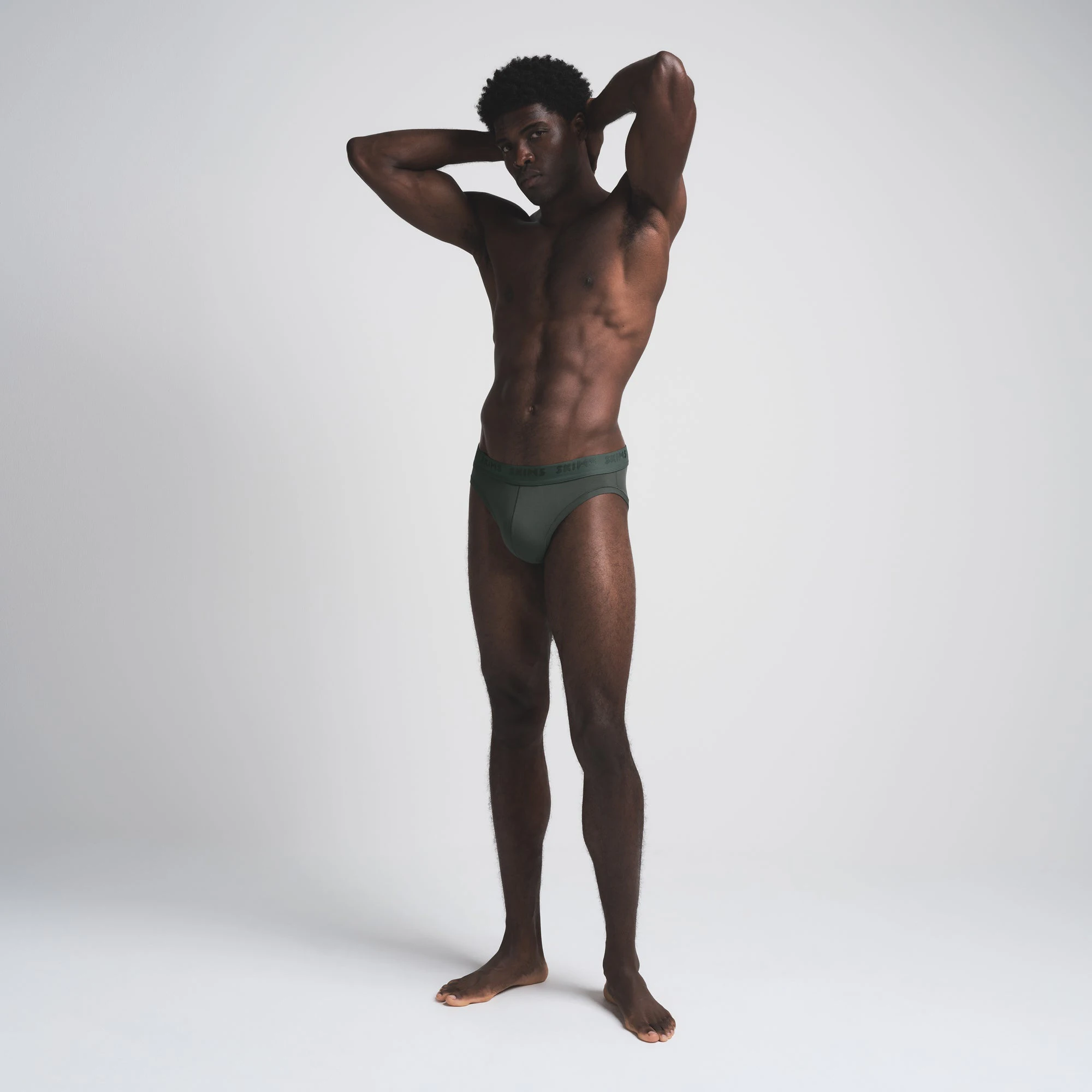 SKIMS STRETCH MENS BRIEF 3-PACK | CYPRESS MULTI ON A MODEL FRONT VIEW
