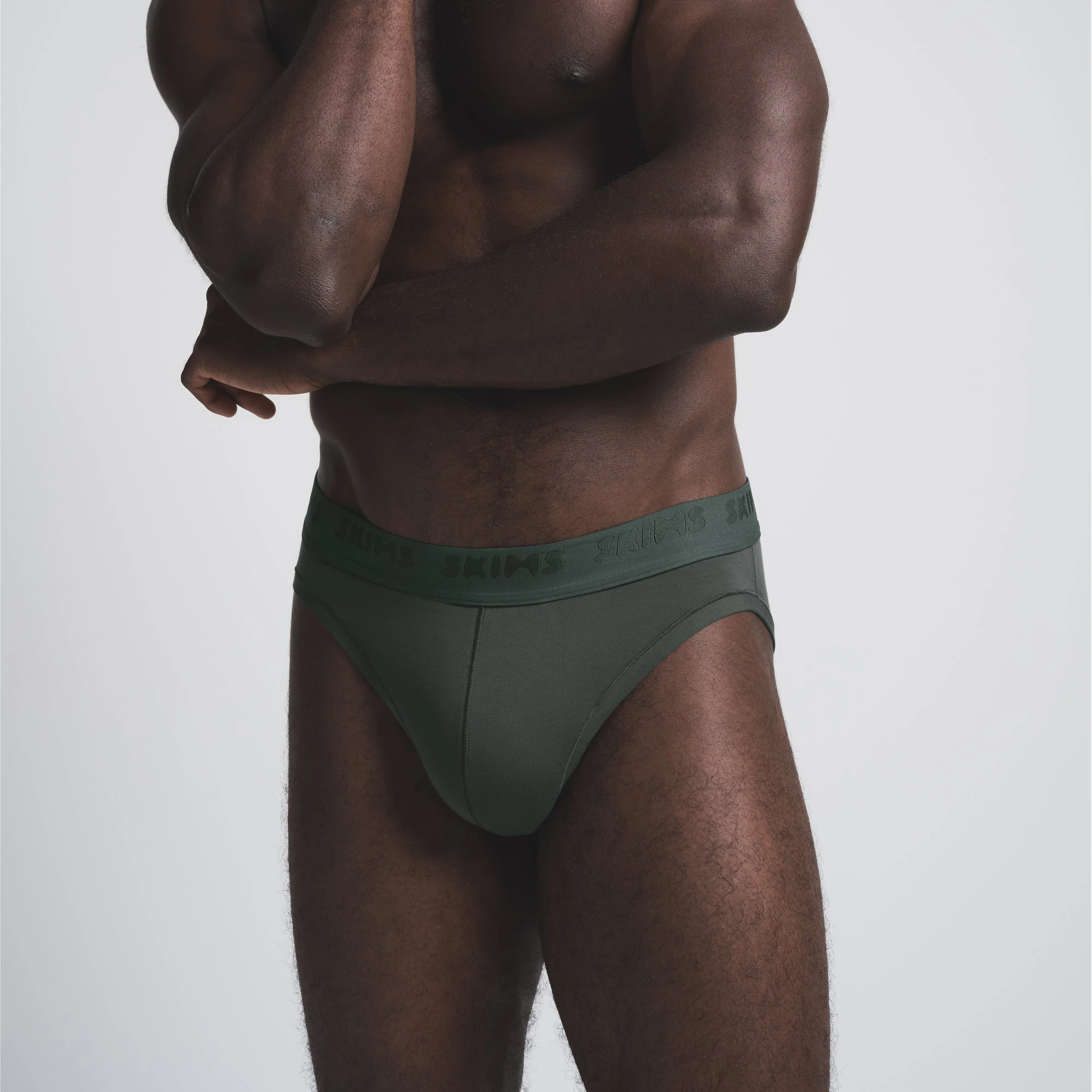 SKIMS STRETCH MENS BRIEF 3-PACK | CYPRESS MULTI ON A MODEL FRONT VIEW