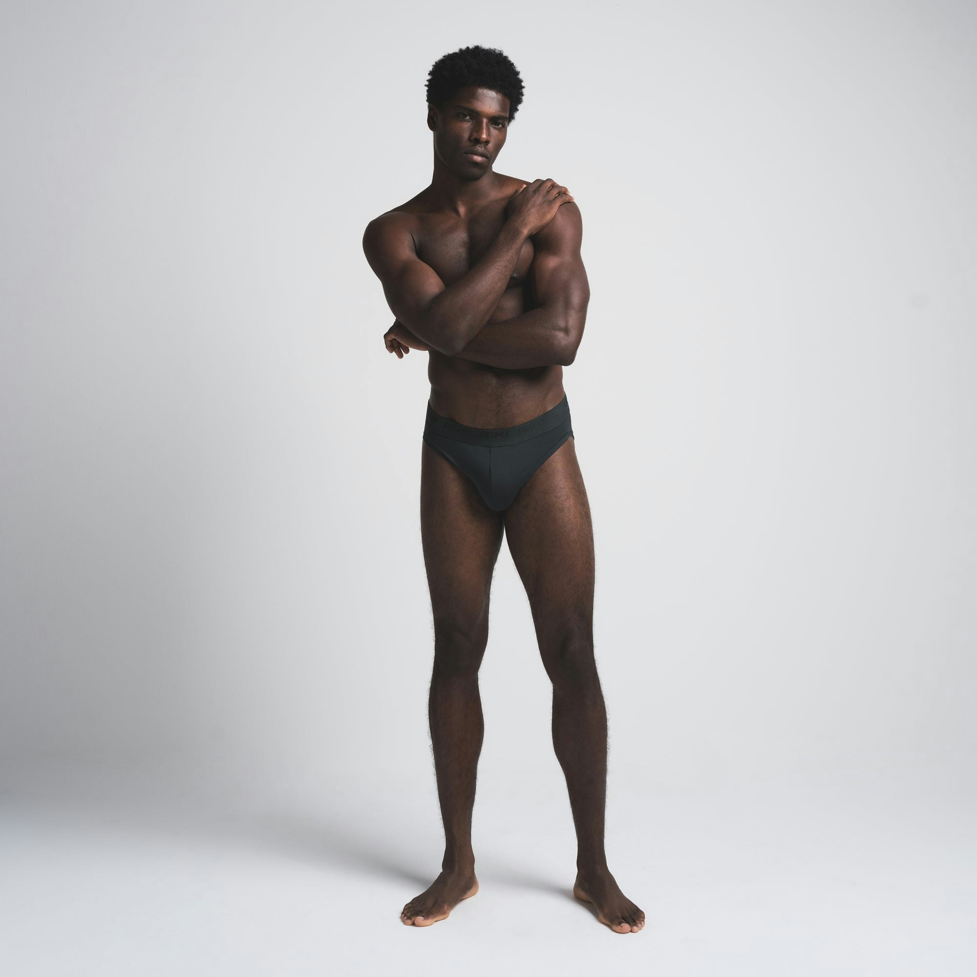 SKIMS STRETCH MENS BRIEF 3-PACK | CYPRESS MULTI ON A MODEL FRONT VIEW | FOCUS: 0.0, 1.0, 0.9