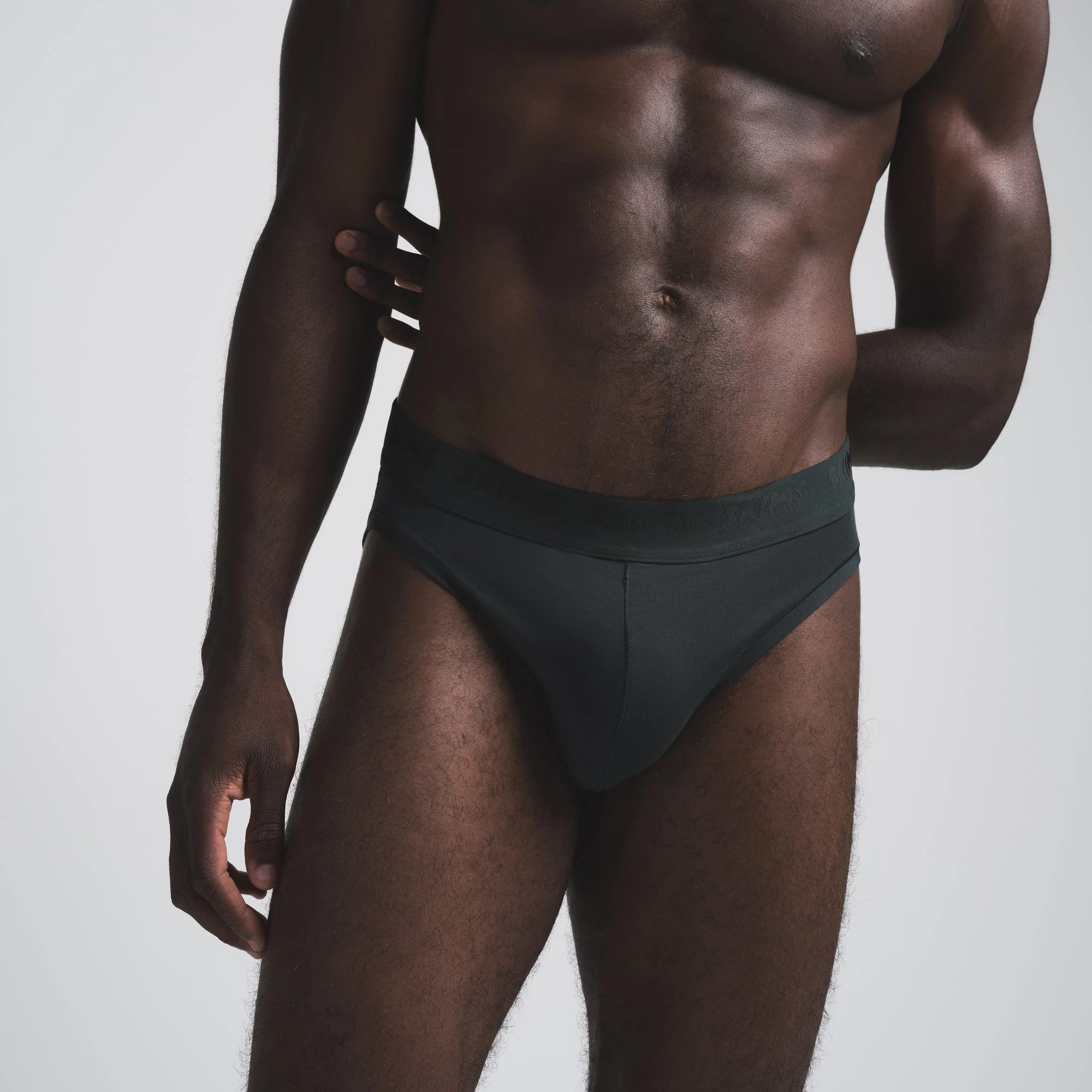 SKIMS STRETCH MENS BRIEF 3-PACK | CYPRESS MULTI ON A MODEL FRONT VIEW