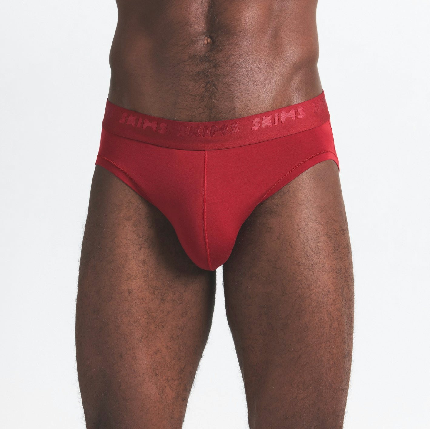 SKIMS STRETCH MENS BRIEF 3-PACK | WOOD MULTI ON A MODEL SIDE VIEW @ | FOCUS: 0.0, 1.0, 0.9