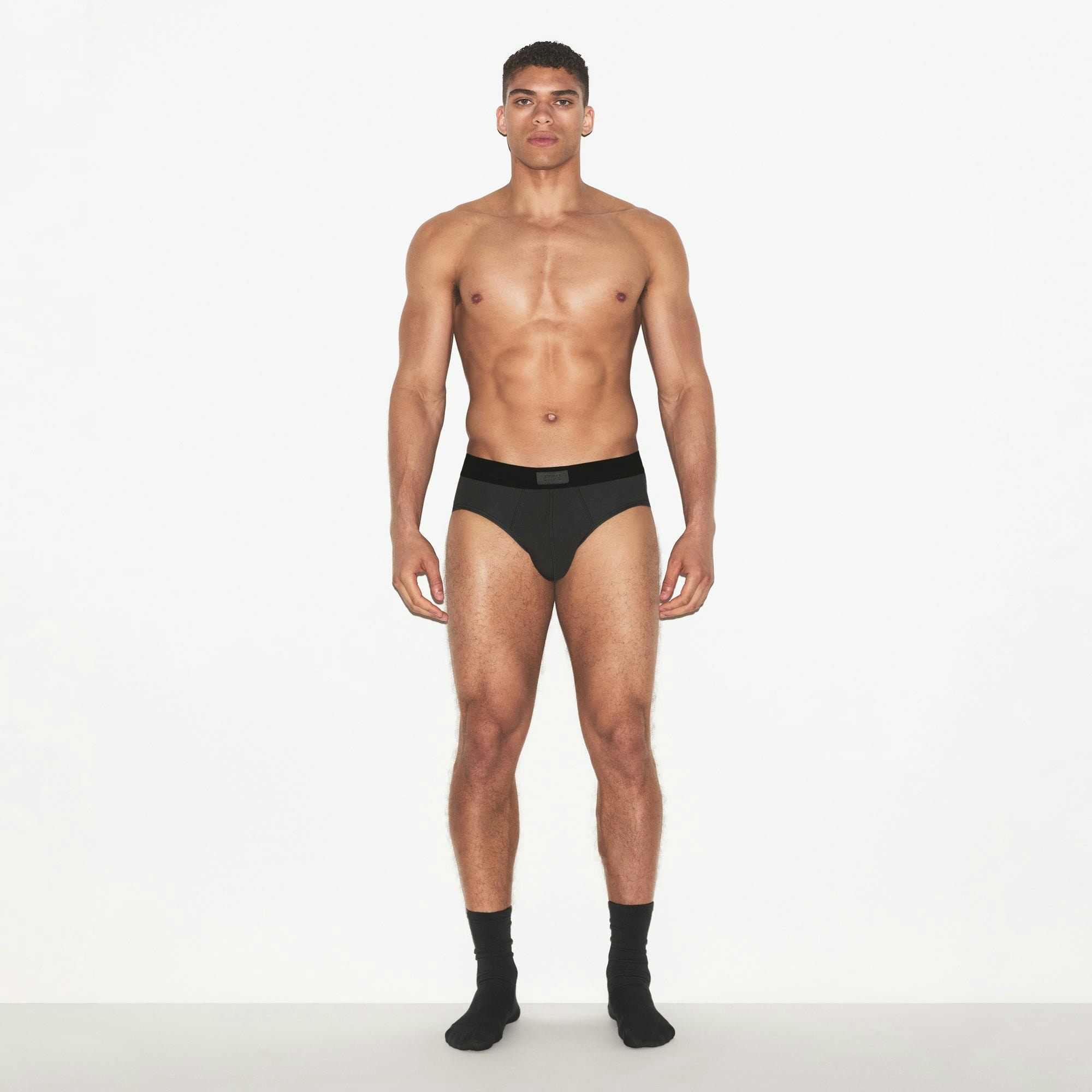 SKIMS COTTON MENS BRIEF 3-PACK | HEATHER MULTI ON A MODEL FRONT VIEW | FOCUS: 0.0, 1.0, 0.9