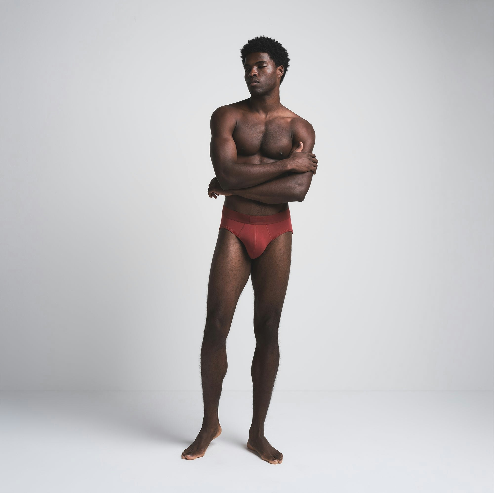 SKIMS COTTON MENS BRIEF 3-PACK | MERLOT MULTI ON A MODEL FRONT VIEW