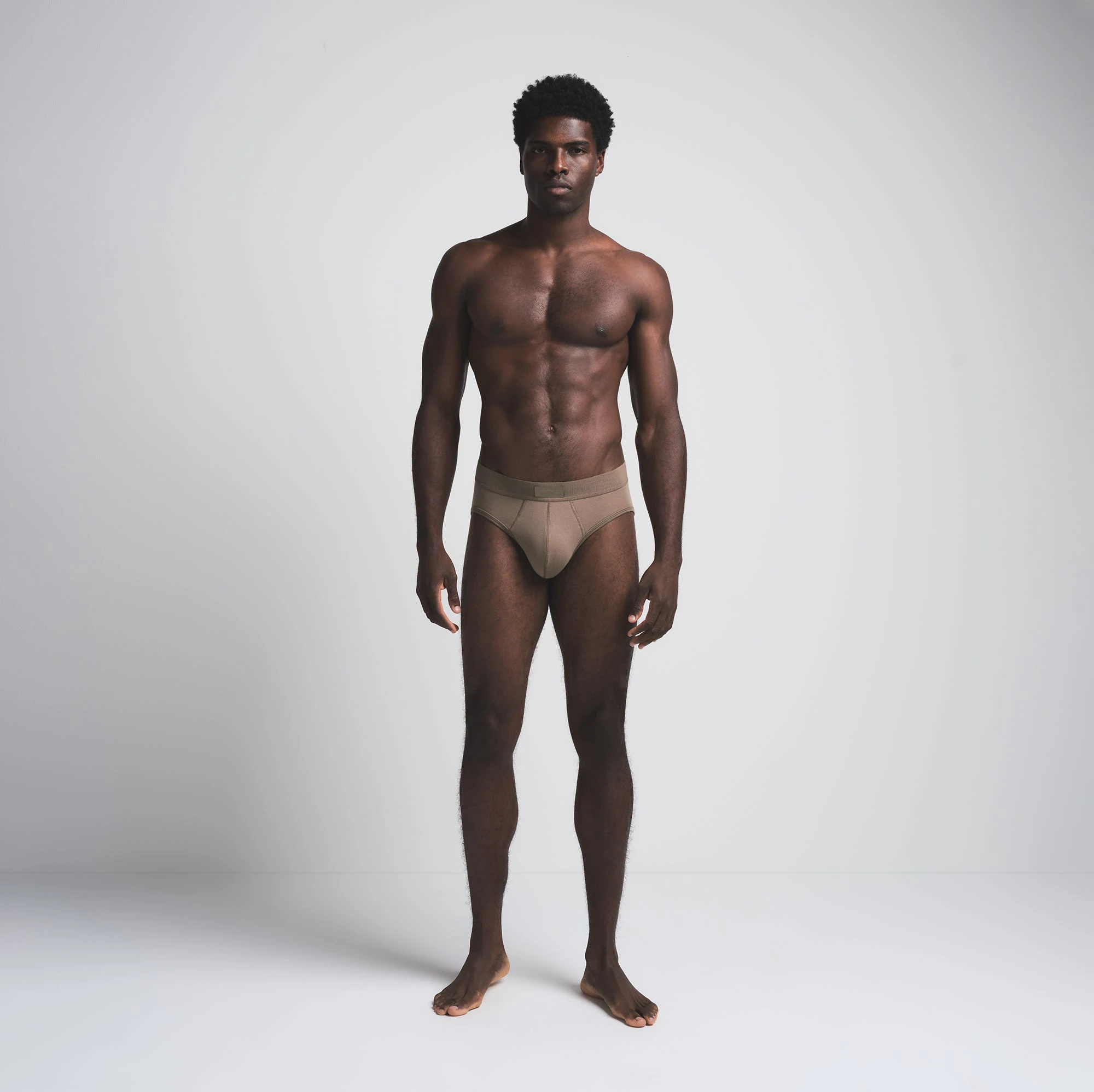 SKIMS COTTON MENS BRIEF 3-PACK | MERLOT MULTI ON A MODEL FRONT VIEW