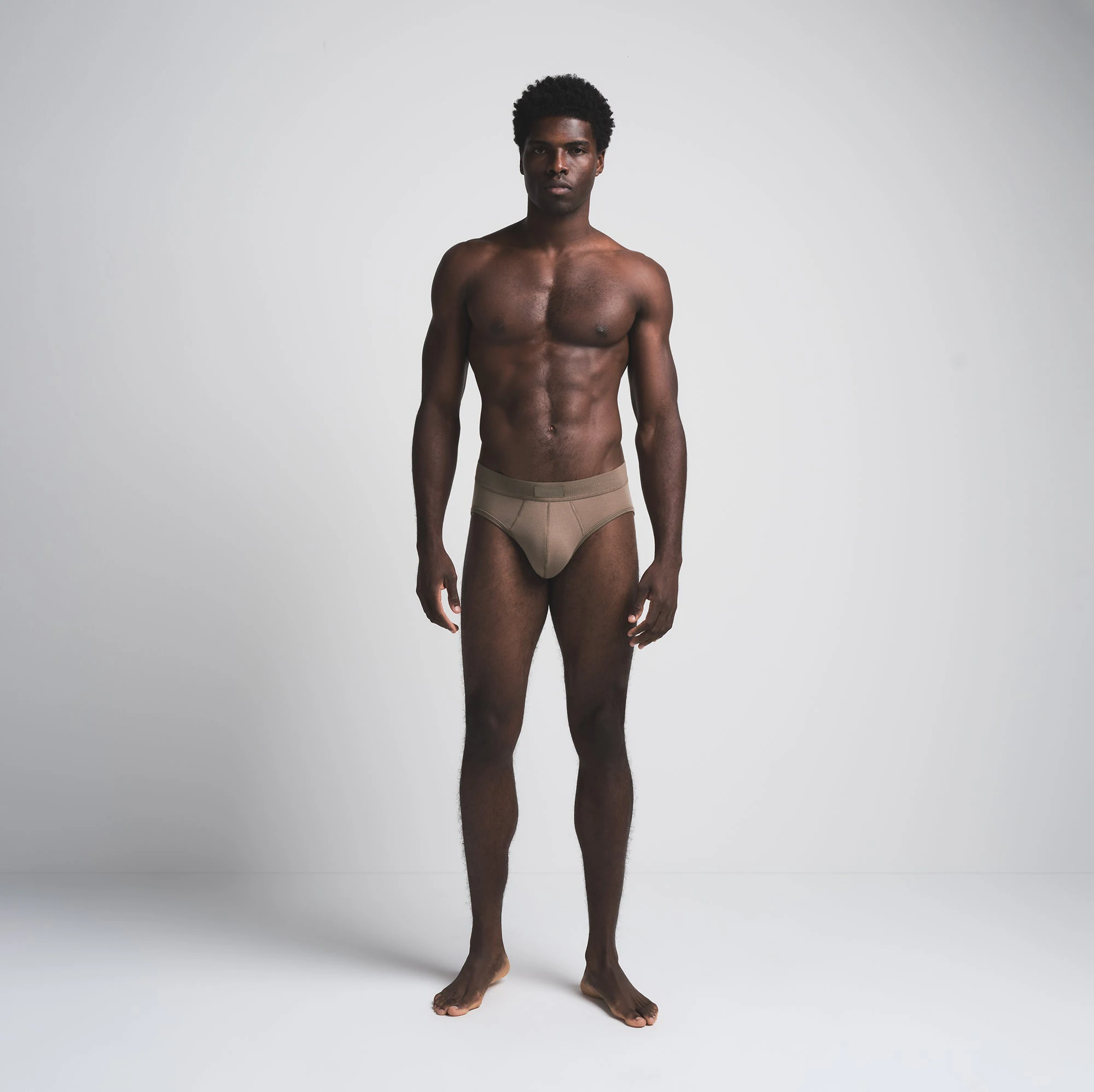 SKIMS COTTON MENS BRIEF 3-PACK | MERLOT MULTI ON A MODEL FRONT VIEW