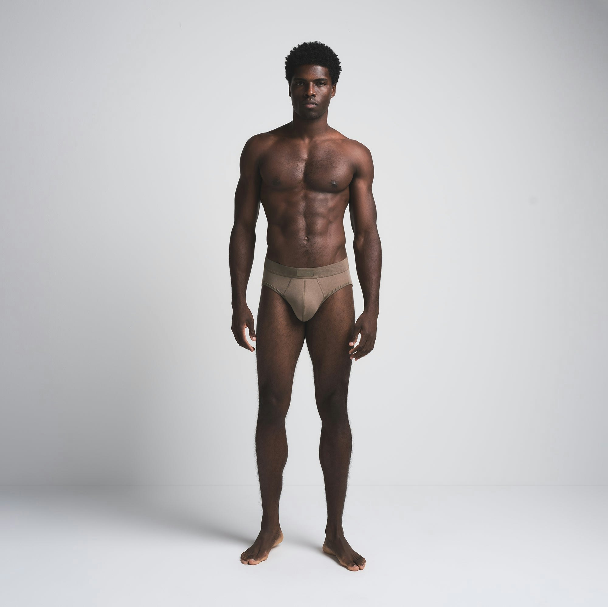 SKIMS COTTON MENS BRIEF 3-PACK | MERLOT MULTI ON A MODEL FRONT VIEW