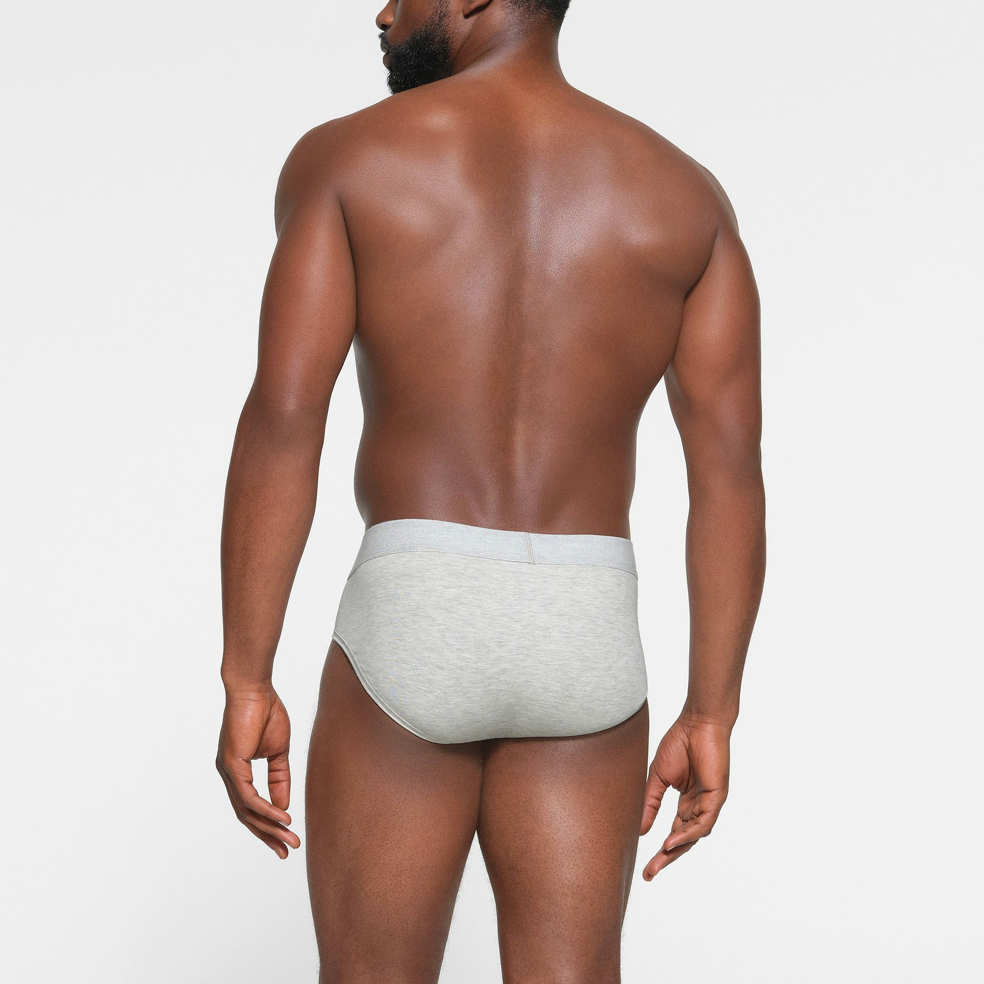 SKIMS COTTON MENS BRIEF 3-PACK ON A MODEL BACK VIEW