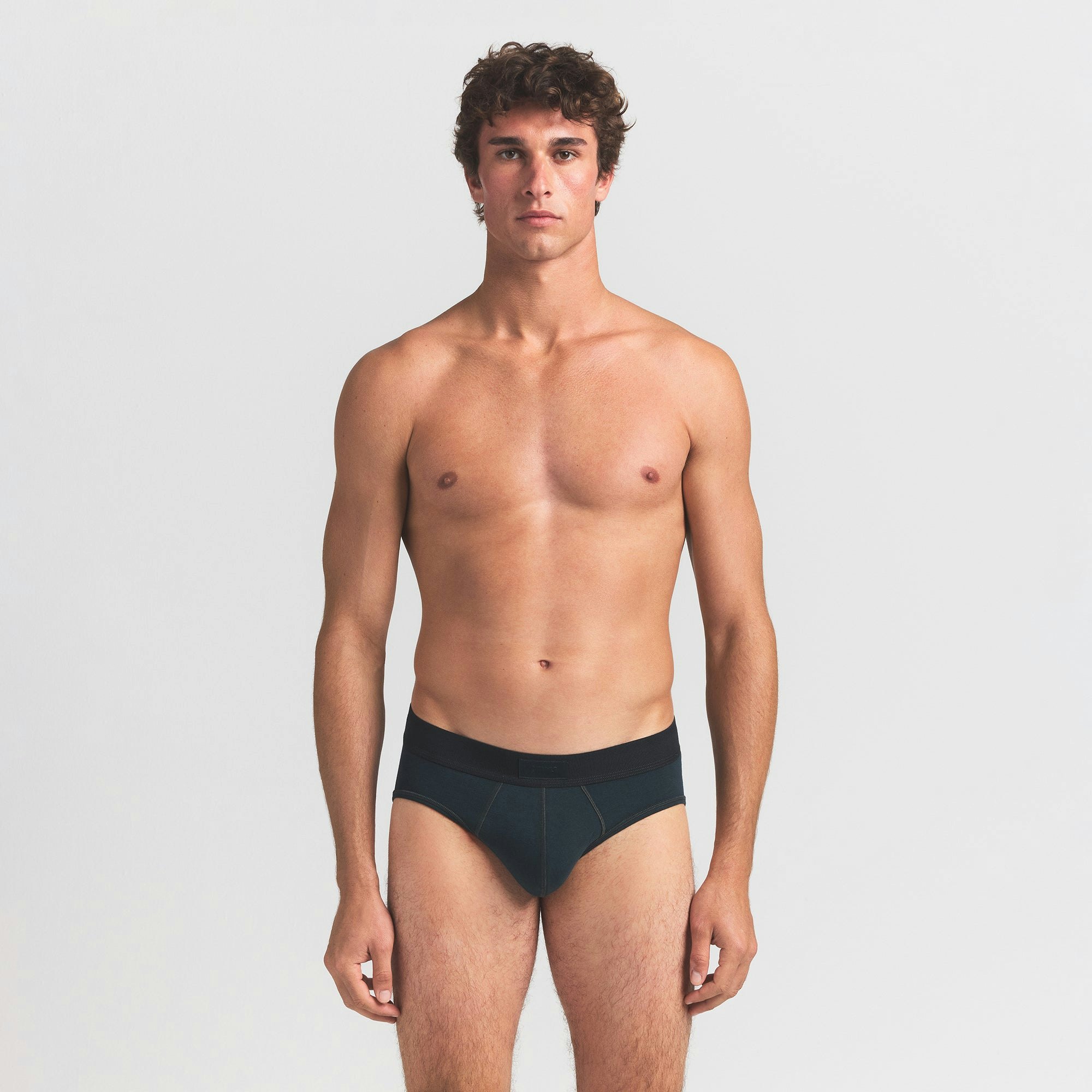 SKIMS COTTON MENS BRIEF 3-PACK | VERDANT MULTI ON A MODEL FRONT VIEW @ | FOCUS: 0.0, 1.0, 0.9