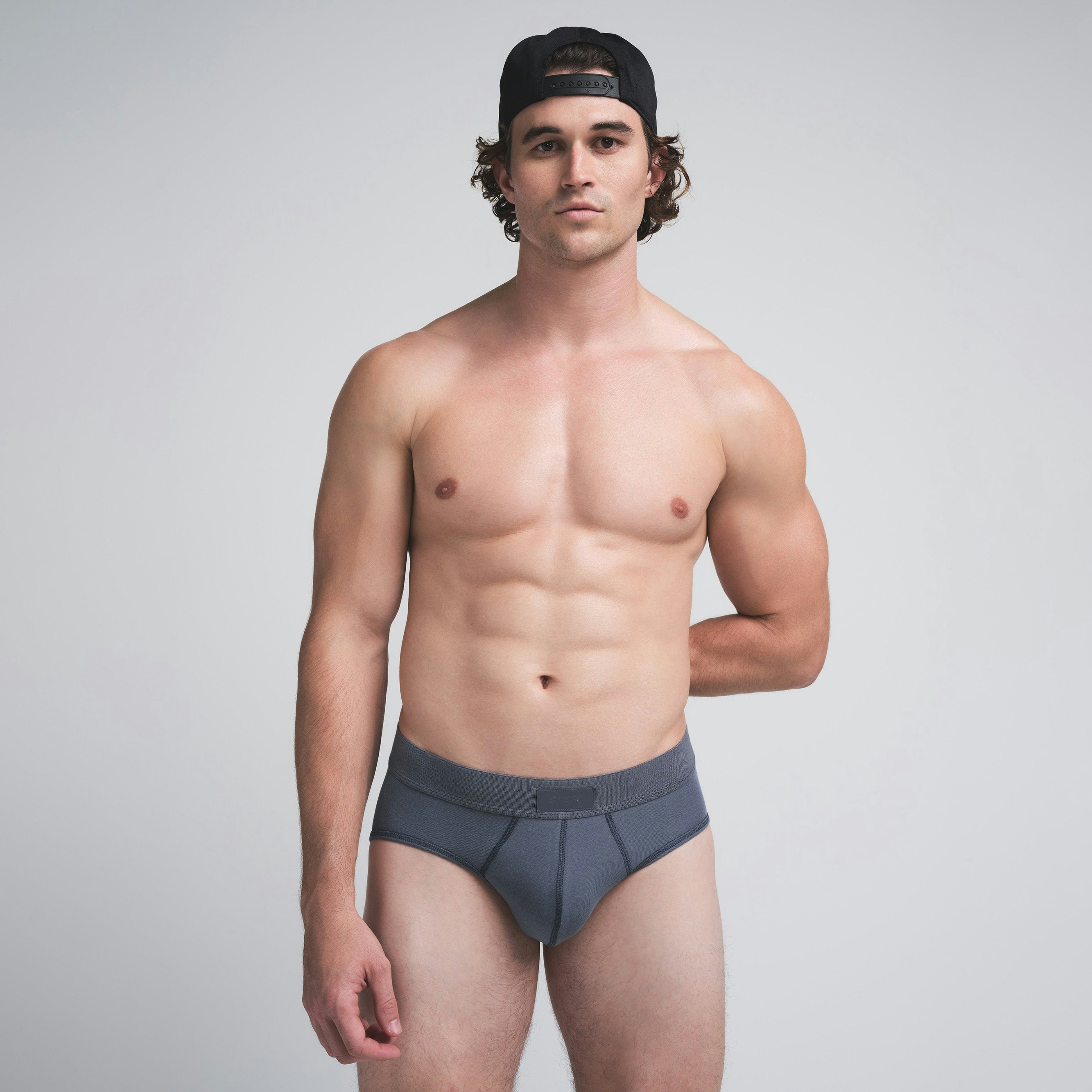 SKIMS COTTON MENS BRIEF | STEEL BLUE ON A MODEL FRONT VIEW | FOCUS: 0.0, 1.0, 0.9