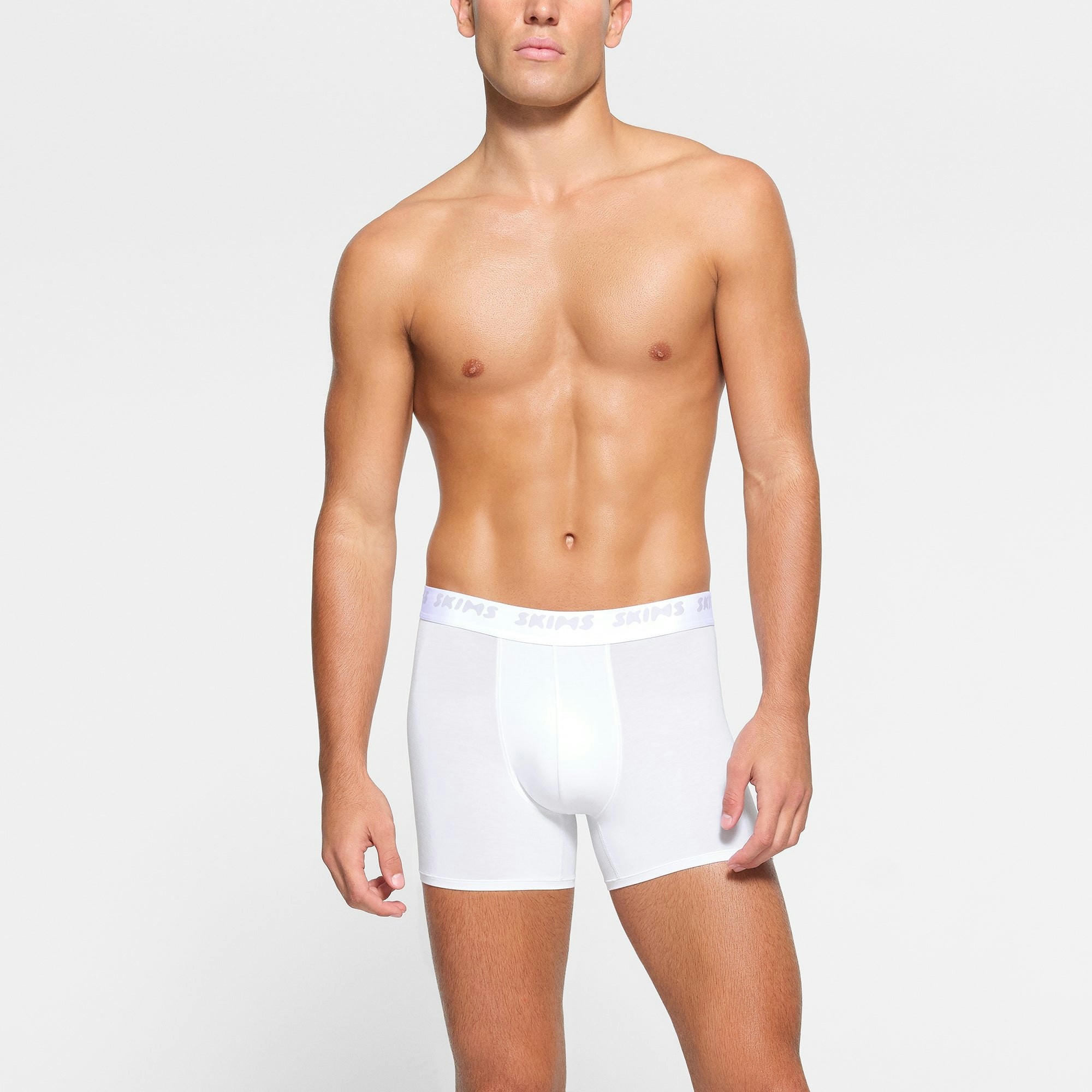 SKIMS STRETCH MENS 3" BOXER BRIEF 3-PACK WORN BY A MODEL IN FRONT VIEW