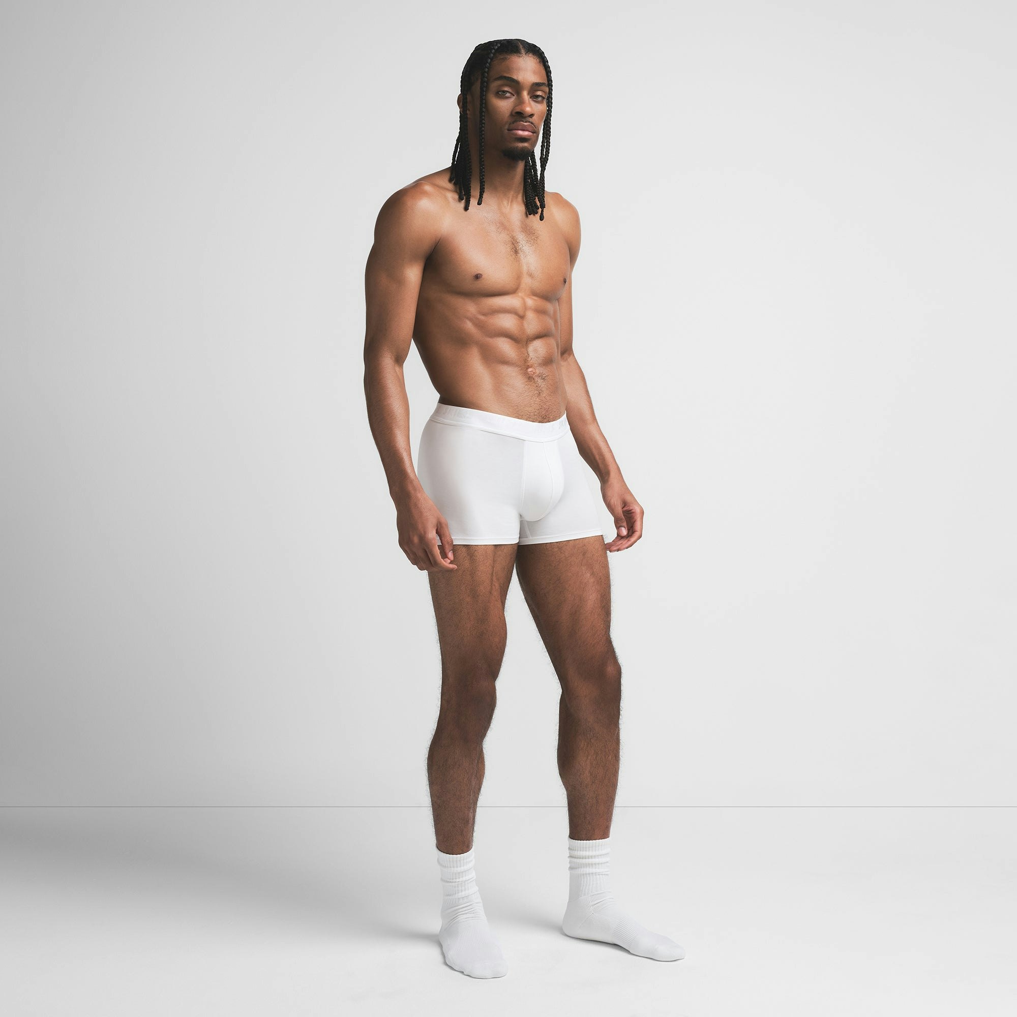 SKIMS STRETCH MENS 3" BOXER BRIEF | CHALK ON A MODEL SIDE VIEW @ | FOCUS: 0.9, 0.1, 0.7