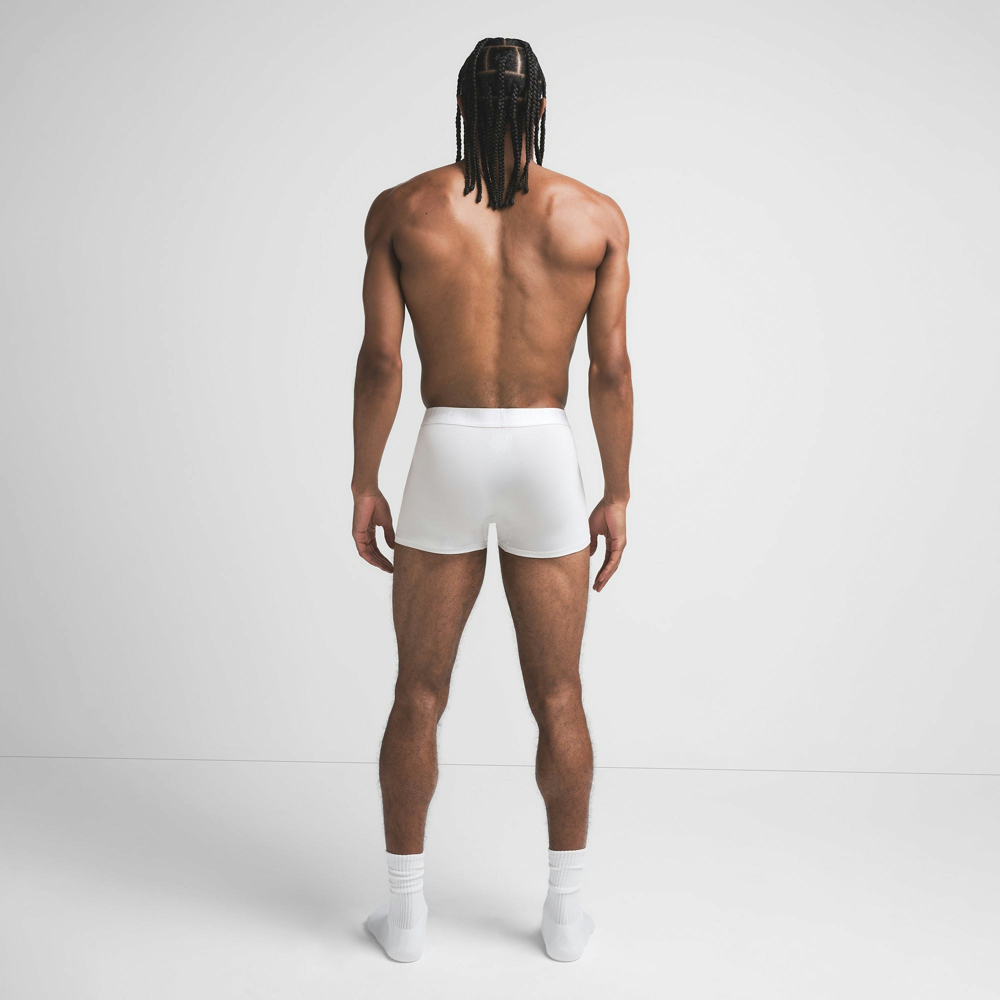 SKIMS STRETCH MENS 3" BOXER BRIEF | CHALK ON A MODEL BACK VIEW @ | FOCUS: 0.9, 0.1, 0.7