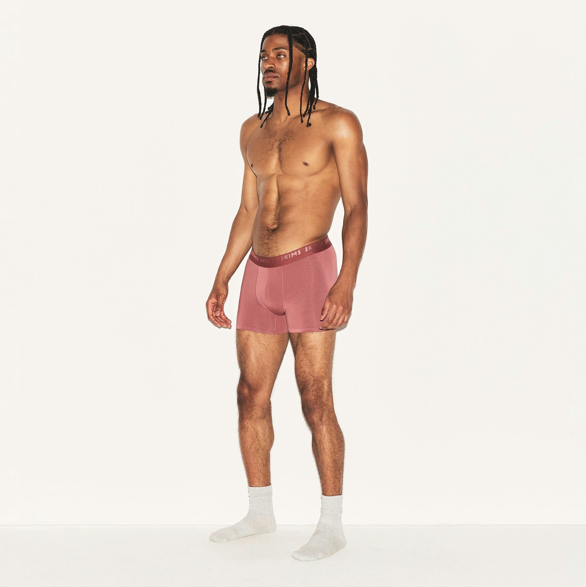 SKIMS STRETCH MENS 3 INCH BOXER BRIEF | CORDOVAN ON A MODEL SIDE VIEW | FOCUS: 0.0, 1.0, 0.9