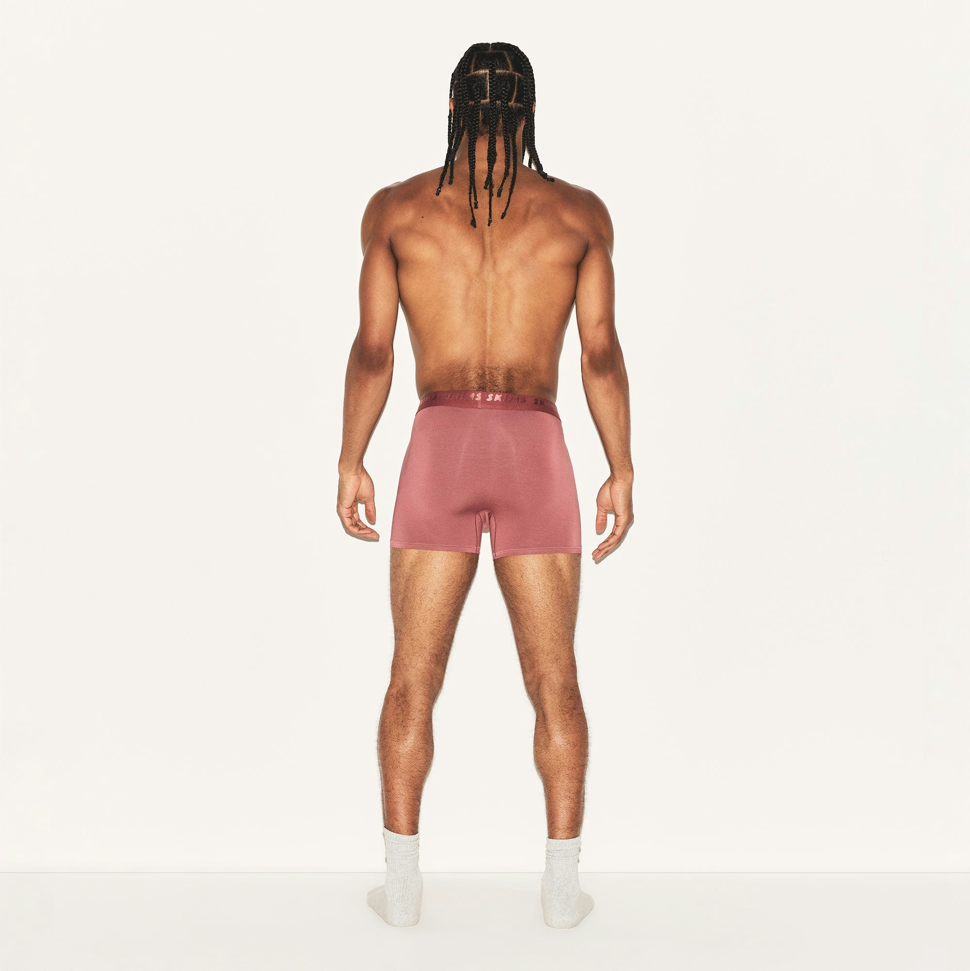 SKIMS STRETCH MENS 3 INCH BOXER BRIEF | CORDOVAN ON A MODEL BACK VIEW | FOCUS: 0.0, 1.0, 0.9