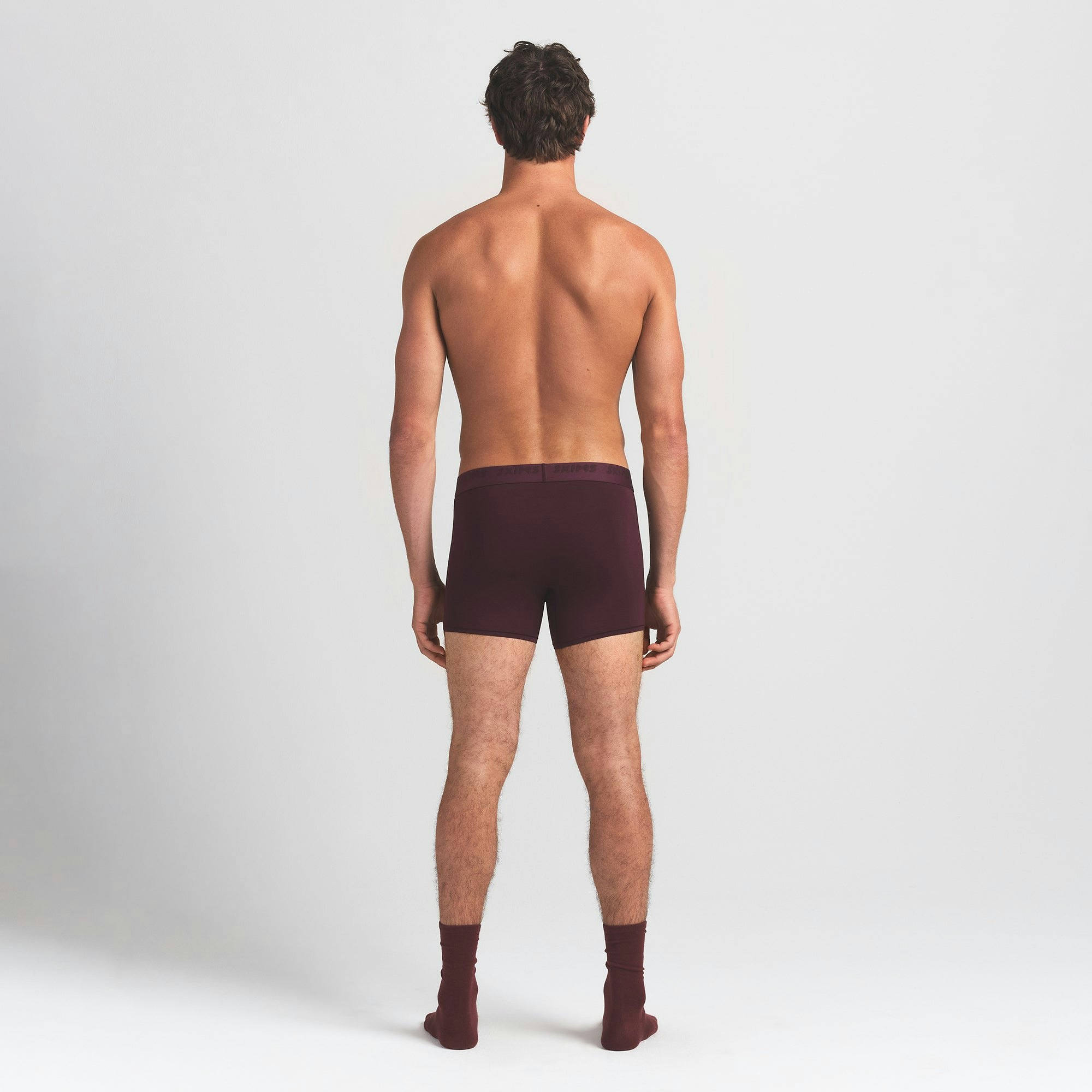 SKIMS STRETCH MENS 3" BOXER BRIEF | CURRANT ON A MODEL BACK VIEW @ | FOCUS: 0.0, 1.0, 0.9
