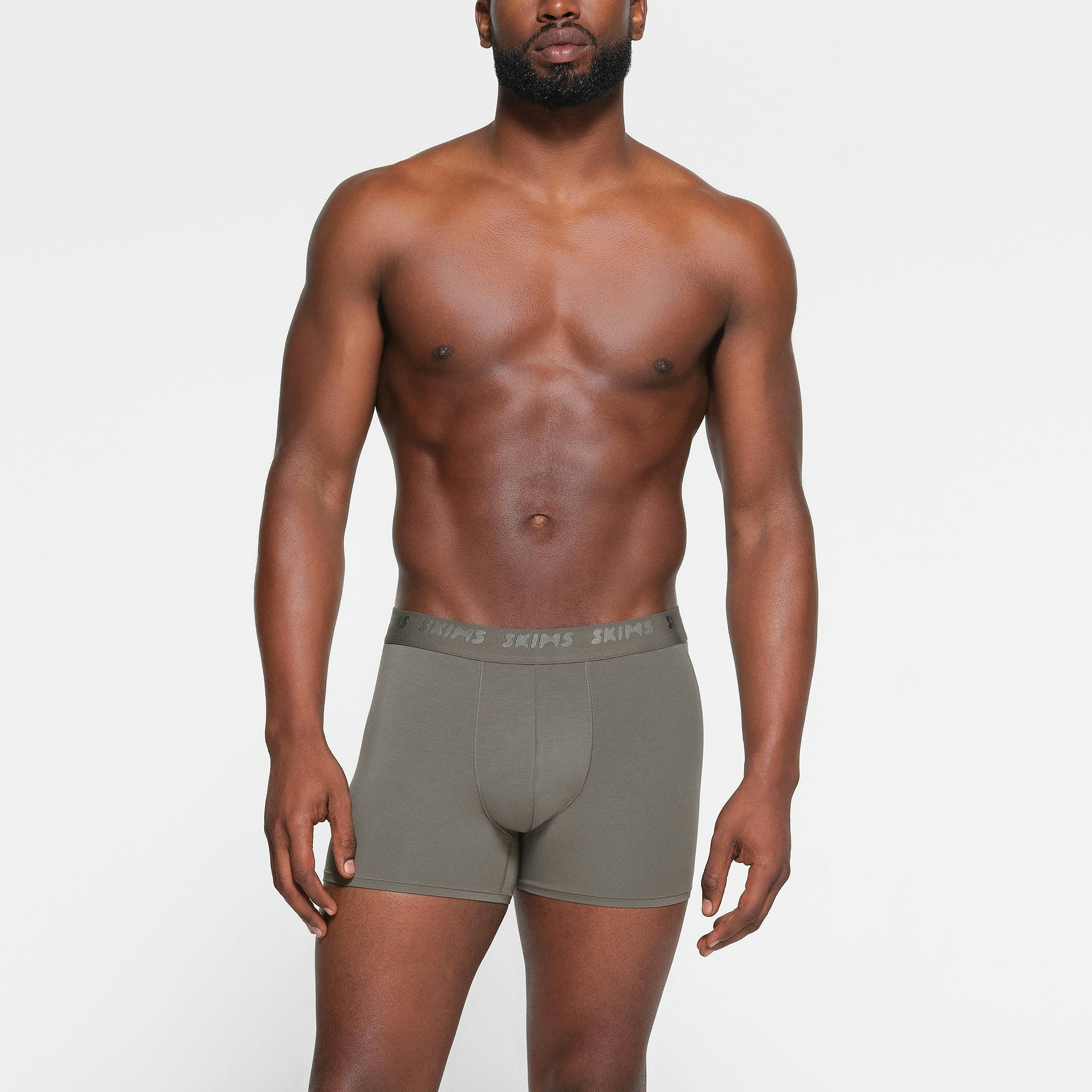 SKIMS STRETCH MENS 3" BOXER BRIEF 3-PACK WORN BY A MODEL IN FRONT VIEW