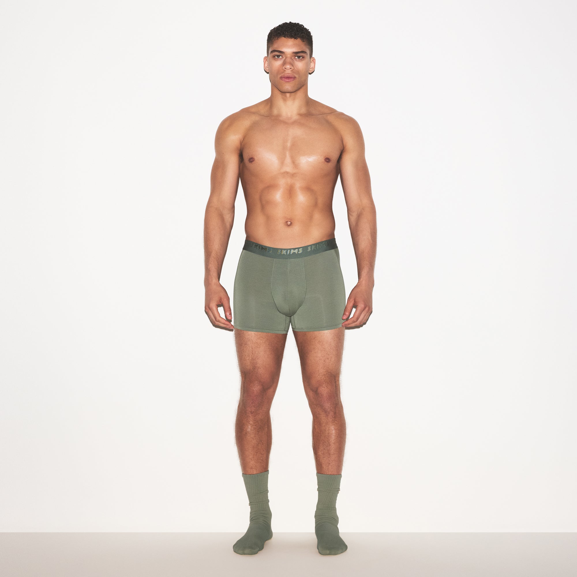 SKIMS STRETCH MENS 3" BOXER BRIEF | LAUREL ON A MODEL FRONT VIEW | FOCUS: 0.0, 1.0, 0.9