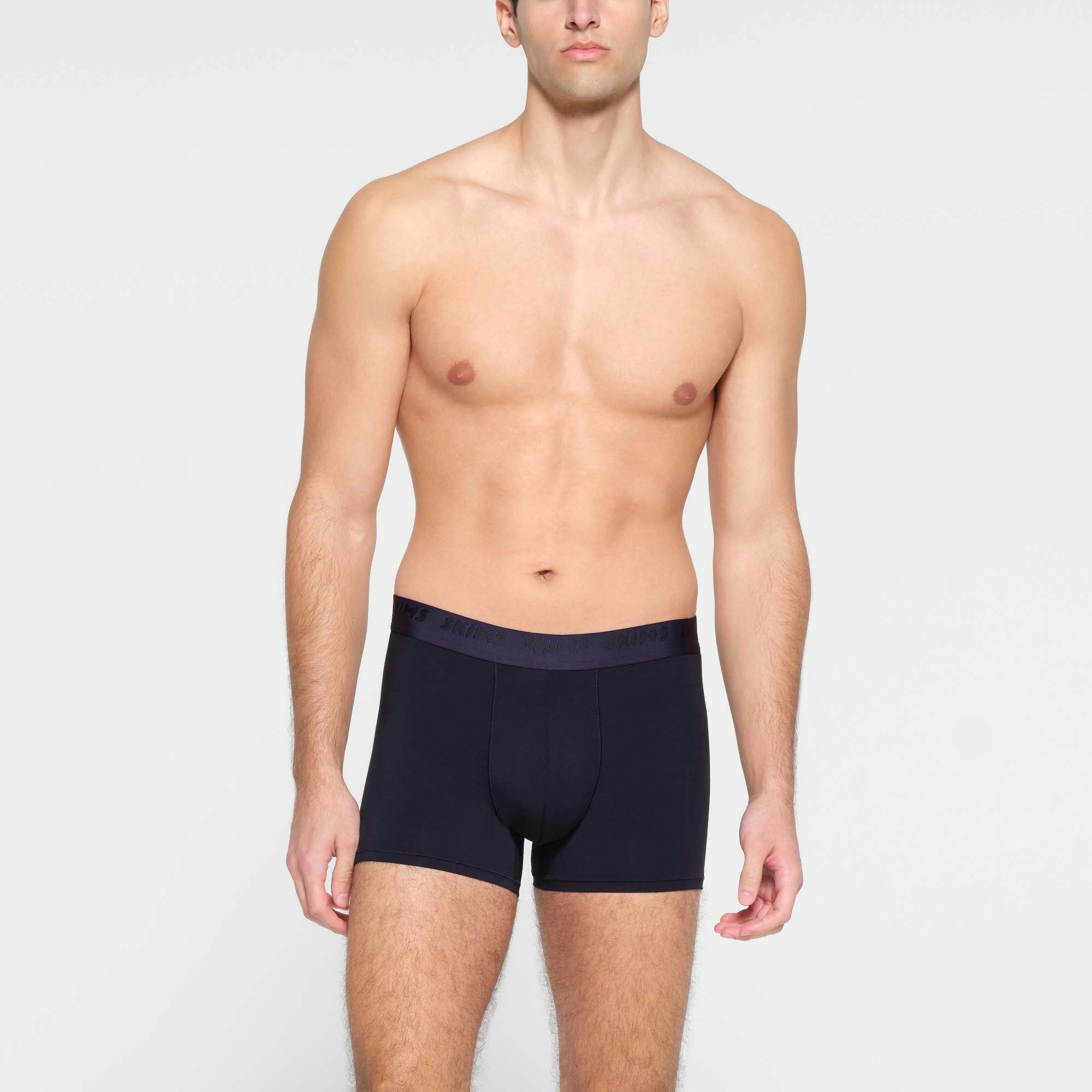 SKIMS STRETCH MENS 3" BOXER BRIEF | MIDNIGHT BLUE | CHALK ON A MODEL FRONT VIEW