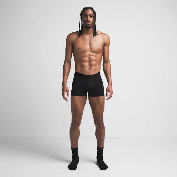SKIMS STRETCH MENS 3" BOXER BRIEF | OBSIDIAN ON A MODEL FRONT VIEW @ | FOCUS: 0.9, 0.1, 0.7