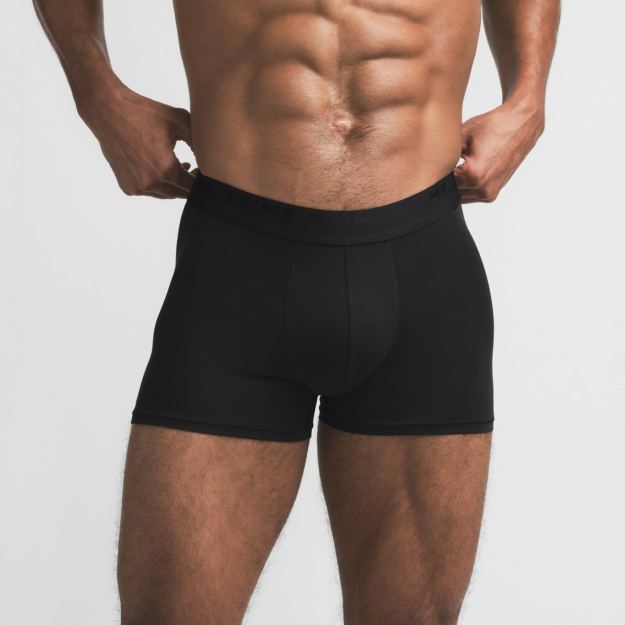SKIMS STRETCH MENS 3" BOXER BRIEF | OBSIDIAN ON A MODEL FRONT VIEW @ | FOCUS: 0.9, 0.1, 0.7