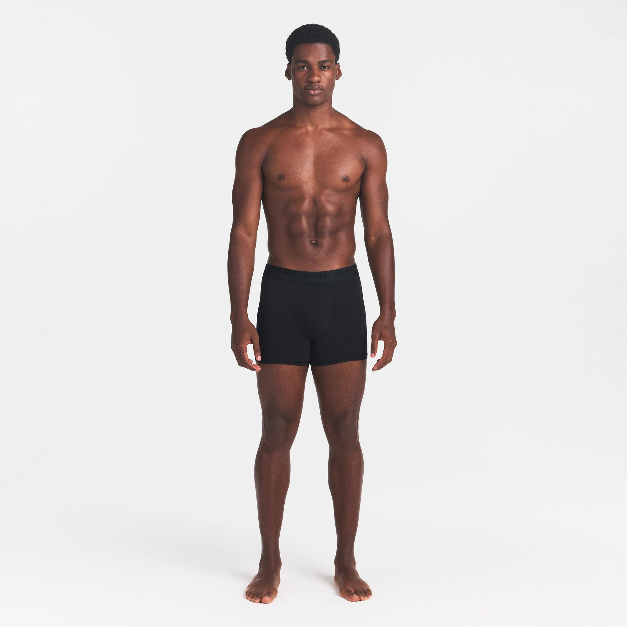 SKIMS STRETCH MENS 3" BOXER BRIEF | OBSIDIAN ON A MODEL FRONT VIEW @ | FOCUS: 0.0, 1.0, 0.9