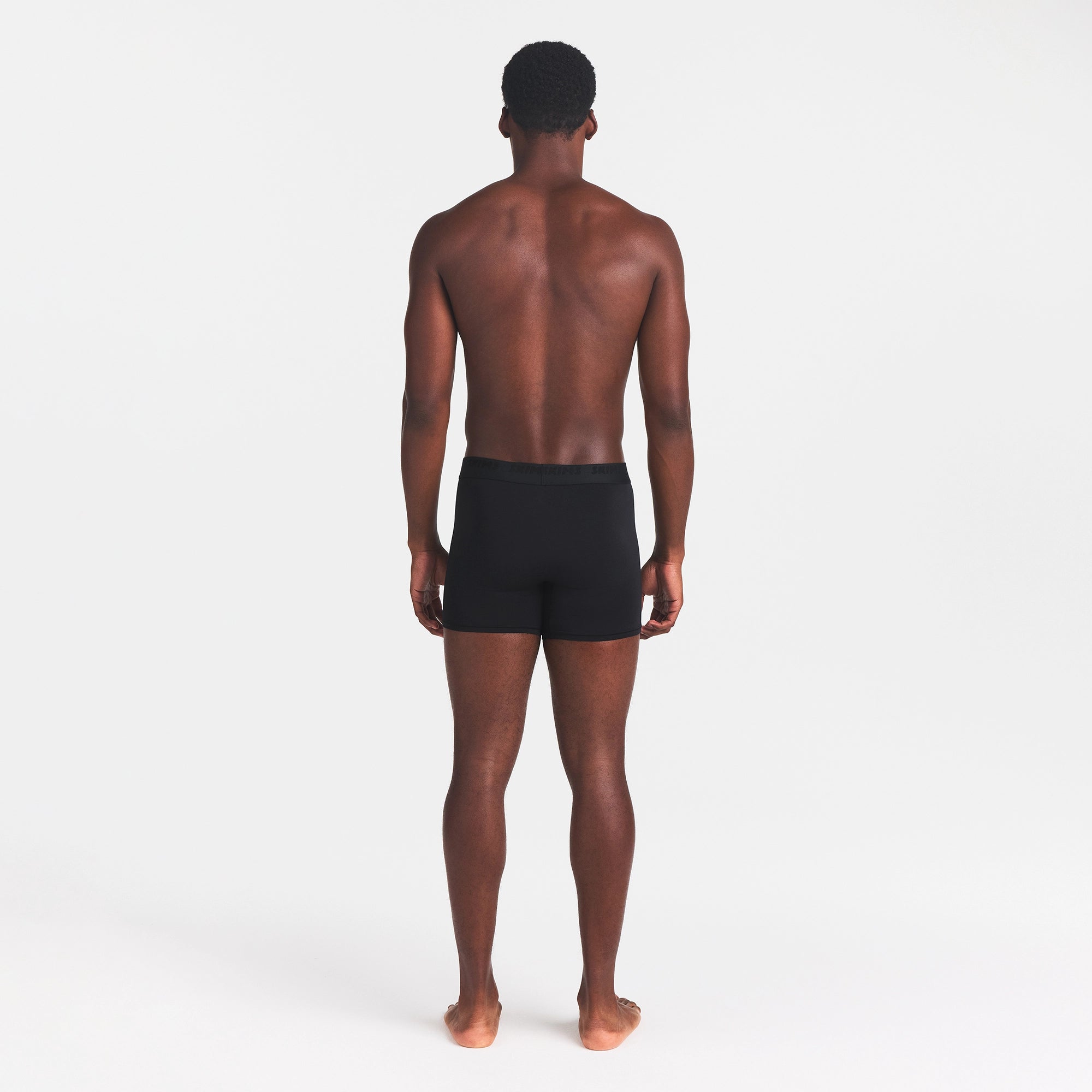 SKIMS STRETCH MENS 3" BOXER BRIEF | OBSIDIAN ON A MODEL BACK VIEW