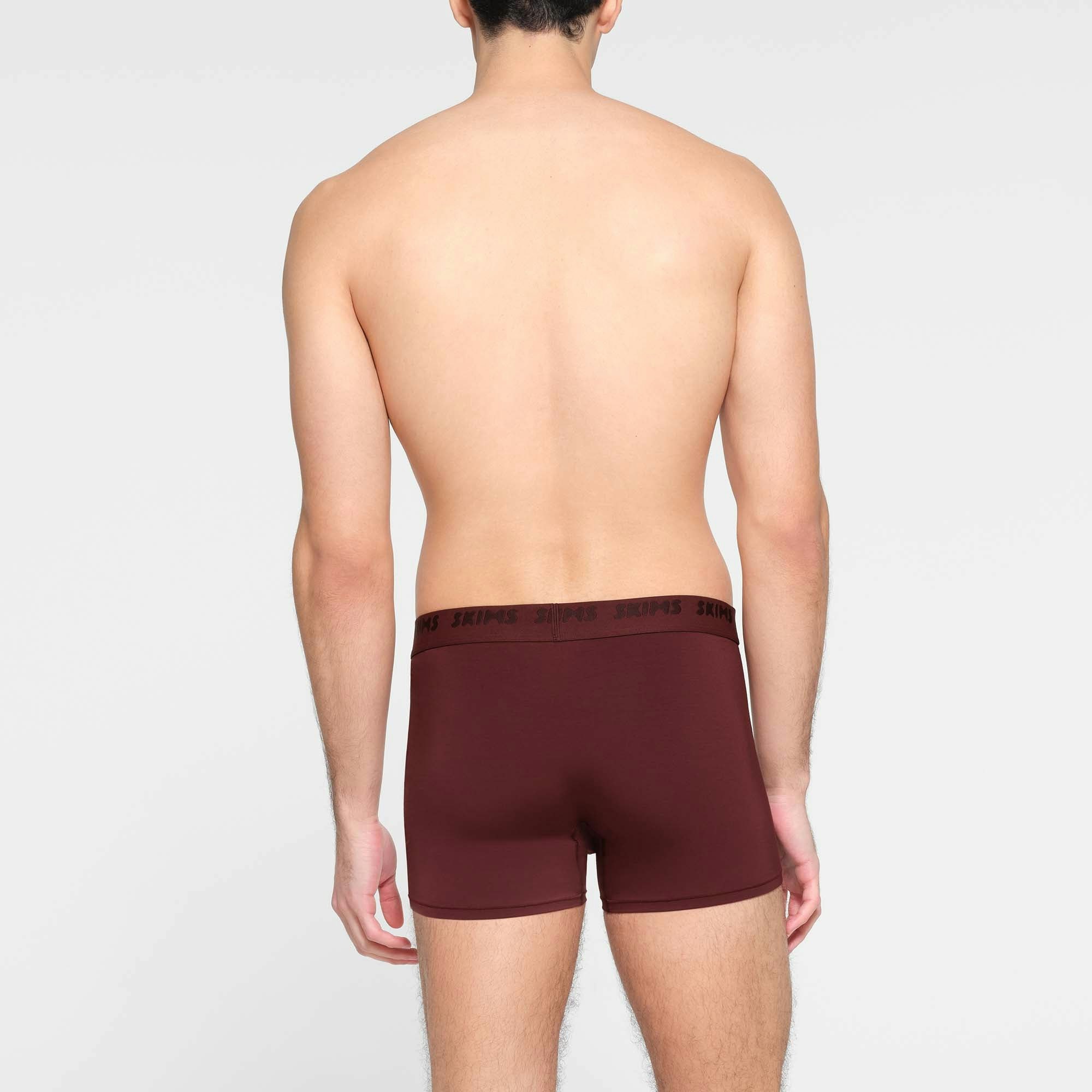 SKIMS STRETCH MENS 3" BOXER BRIEF | OXBLOOD ON A MODEL BACK VIEW