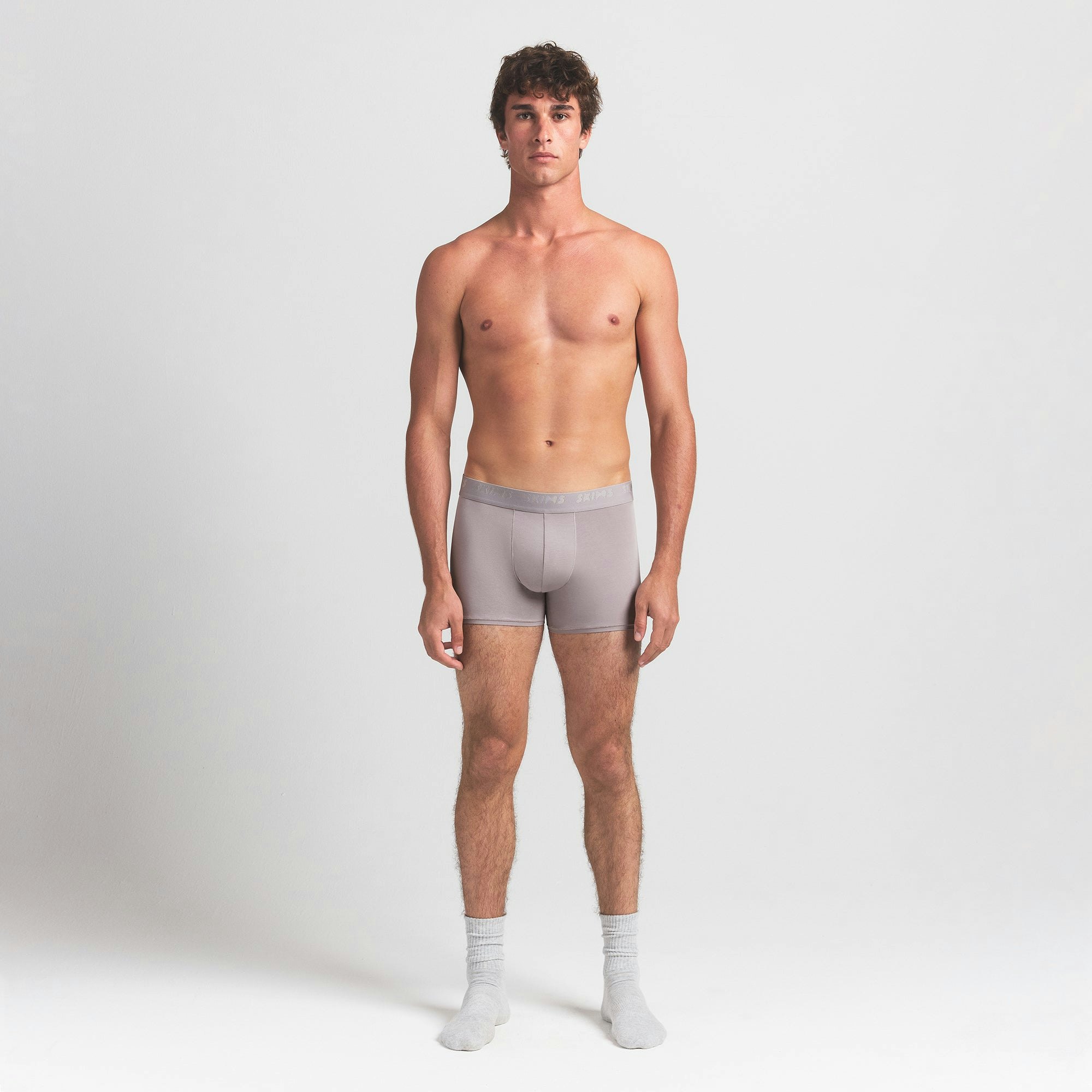 SKIMS STRETCH MENS 3" BOXER BRIEF | OYSTER ON A MODEL FRONT VIEW @ | FOCUS: 0.0, 1.0, 0.9