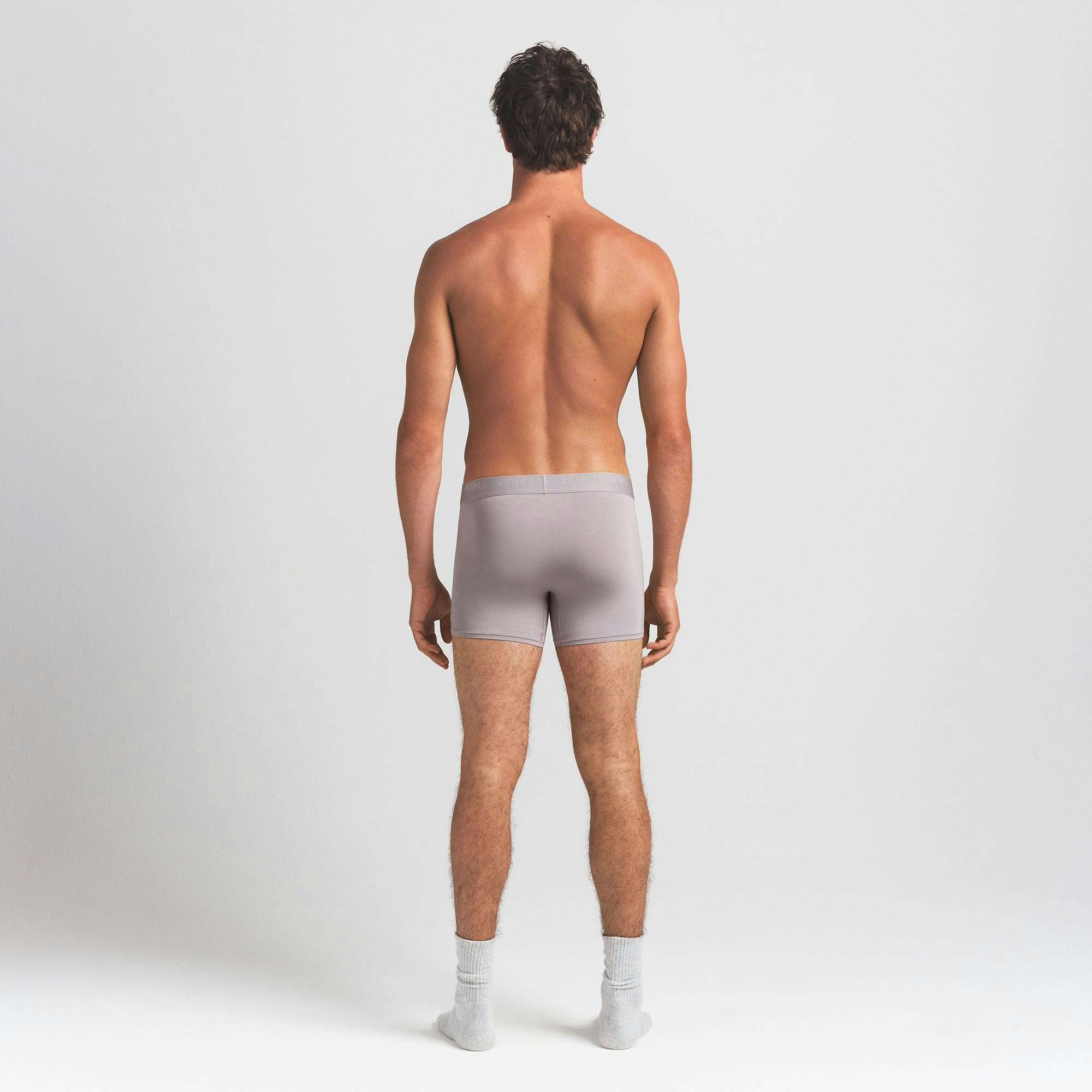 SKIMS STRETCH MENS 3" BOXER BRIEF | OYSTER ON A MODEL BACK VIEW @ | FOCUS: 0.0, 1.0, 0.9