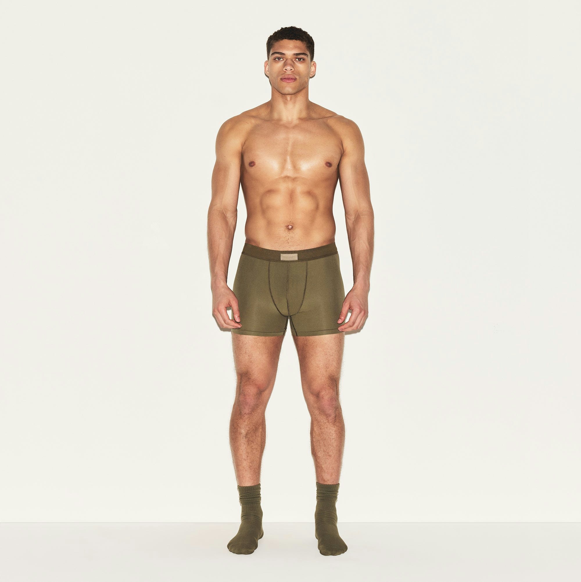 SKIMS COTTON MENS 3 INCH BOXER BRIEF | ARMY ON A MODEL FRONT VIEW | FOCUS: 0.0, 1.0, 0.9