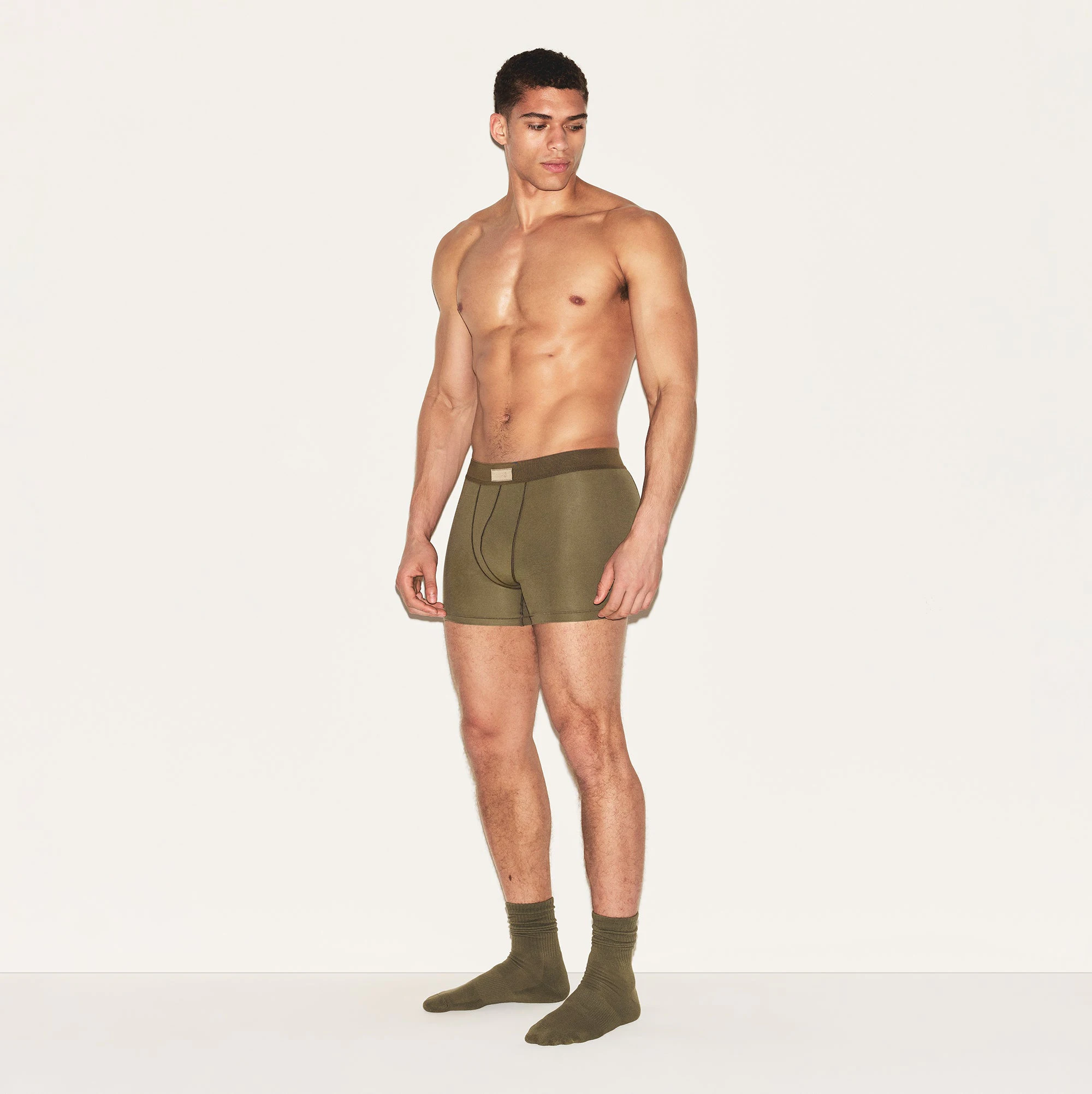SKIMS COTTON MENS 3 INCH BOXER BRIEF | ARMY ON A MODEL SIDE VIEW | FOCUS: 0.0, 1.0, 0.9