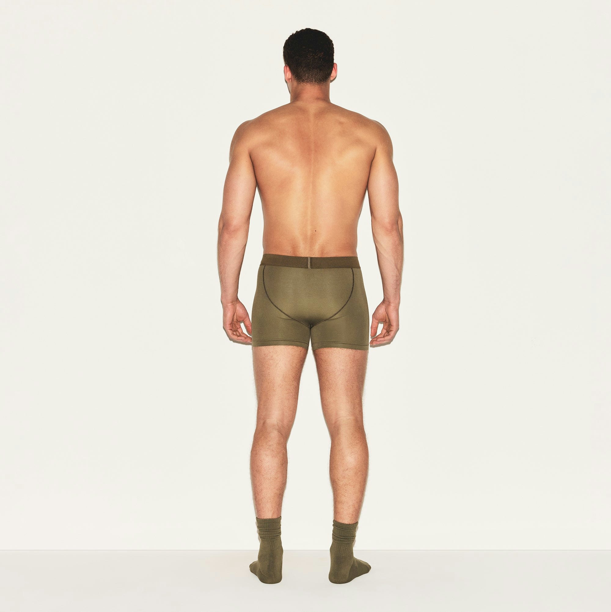 SKIMS COTTON MENS 3 INCH BOXER BRIEF | ARMY ON A MODEL BACK VIEW | FOCUS: 0.0, 1.0, 0.9