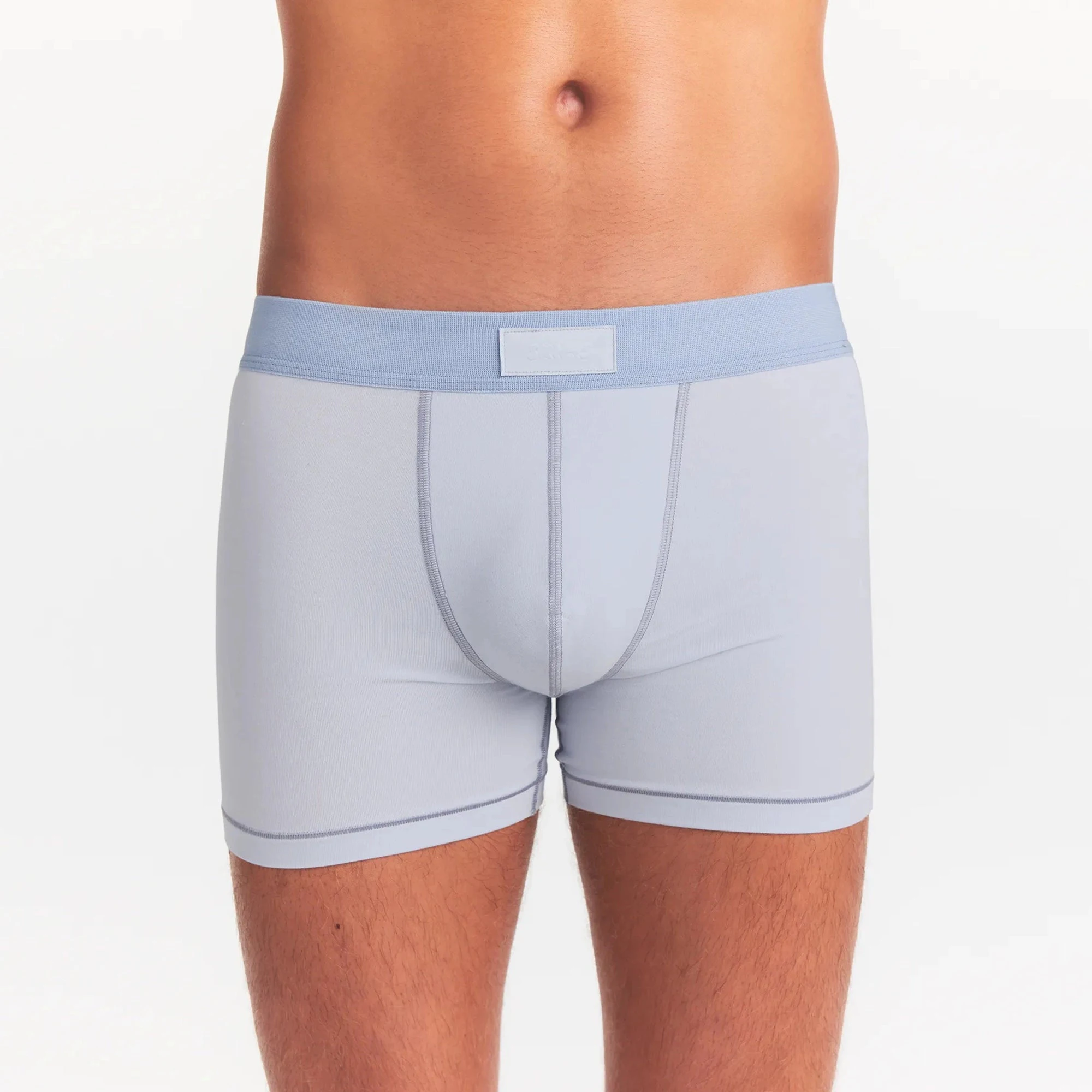 SKIMS COTTON MENS 3" BOXER BRIEF | ATMOSPHERE ON A MODEL FRONT VIEW