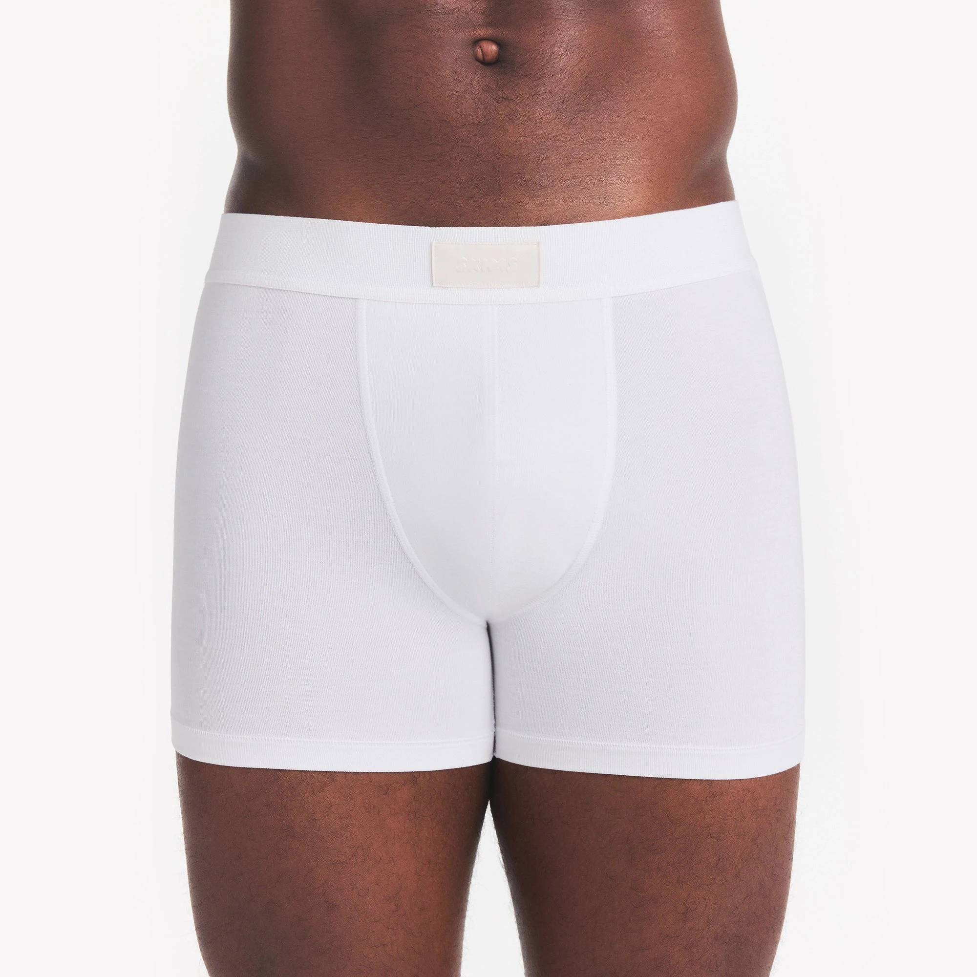 SKIMS COTTON MENS 3" BOXER BRIEF | CHALK ON A MODEL FRONT VIEW