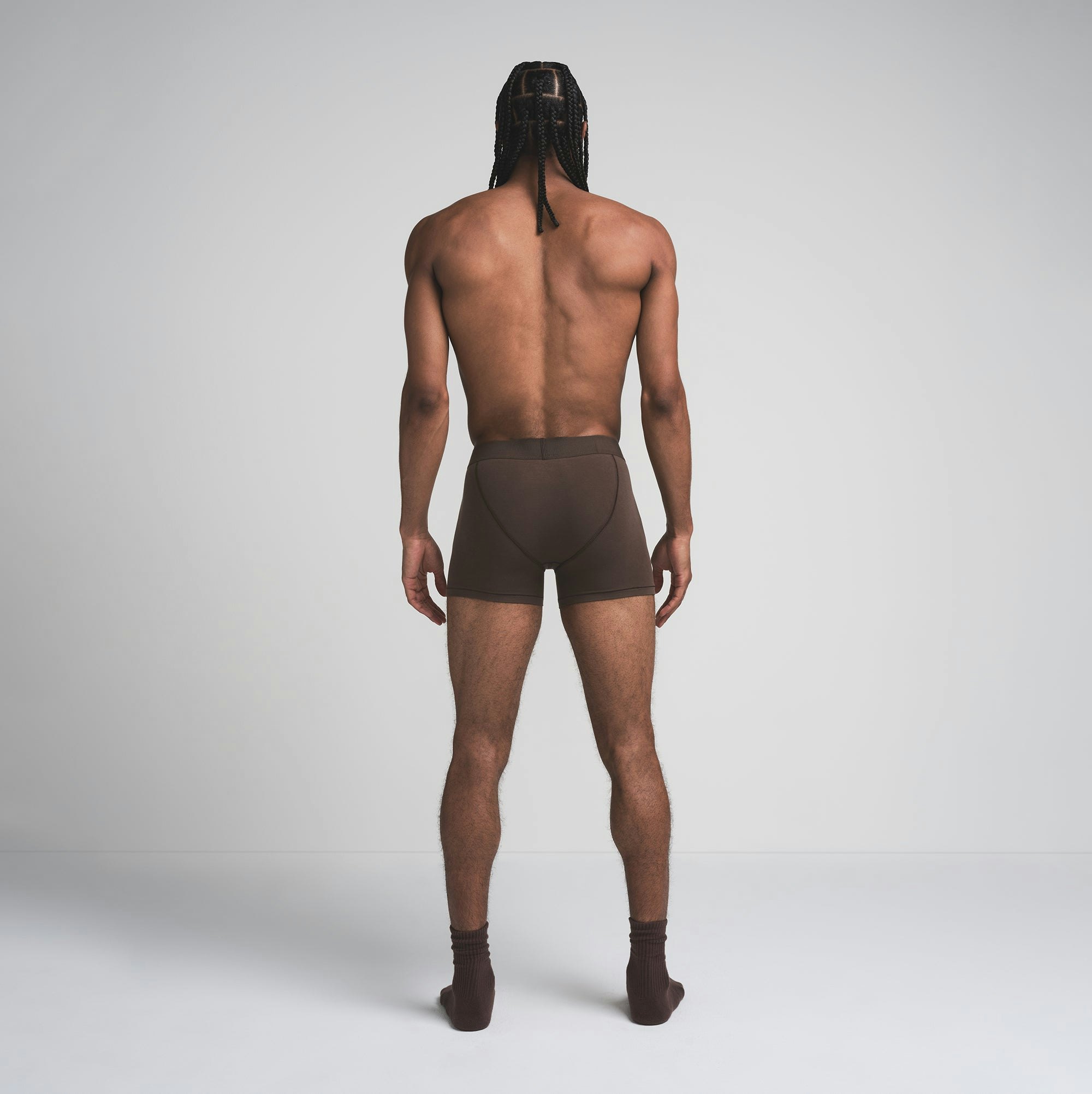 SKIMS COTTON MENS 3 INCH BOXER BRIEF | DARK SEPIA ON A MODEL FRONT VIEW | FOCUS: 0.0, 1.0, 0.9